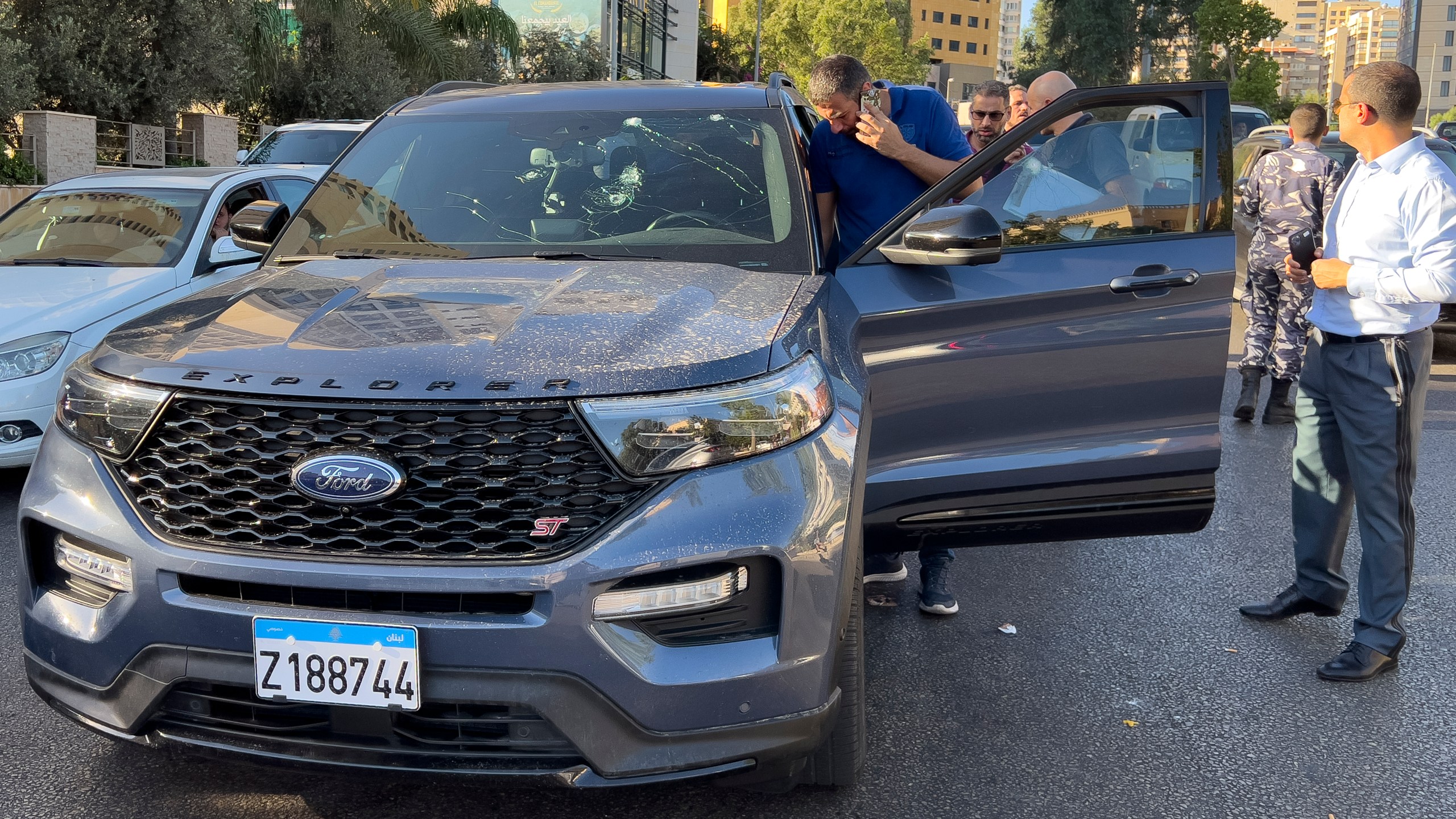 Police officers inspect a car inside of which a hand-held pager exploded, Beirut, Lebanon, Tuesday, Sept. 17, 2024. (AP Photo/Hussein Malla)