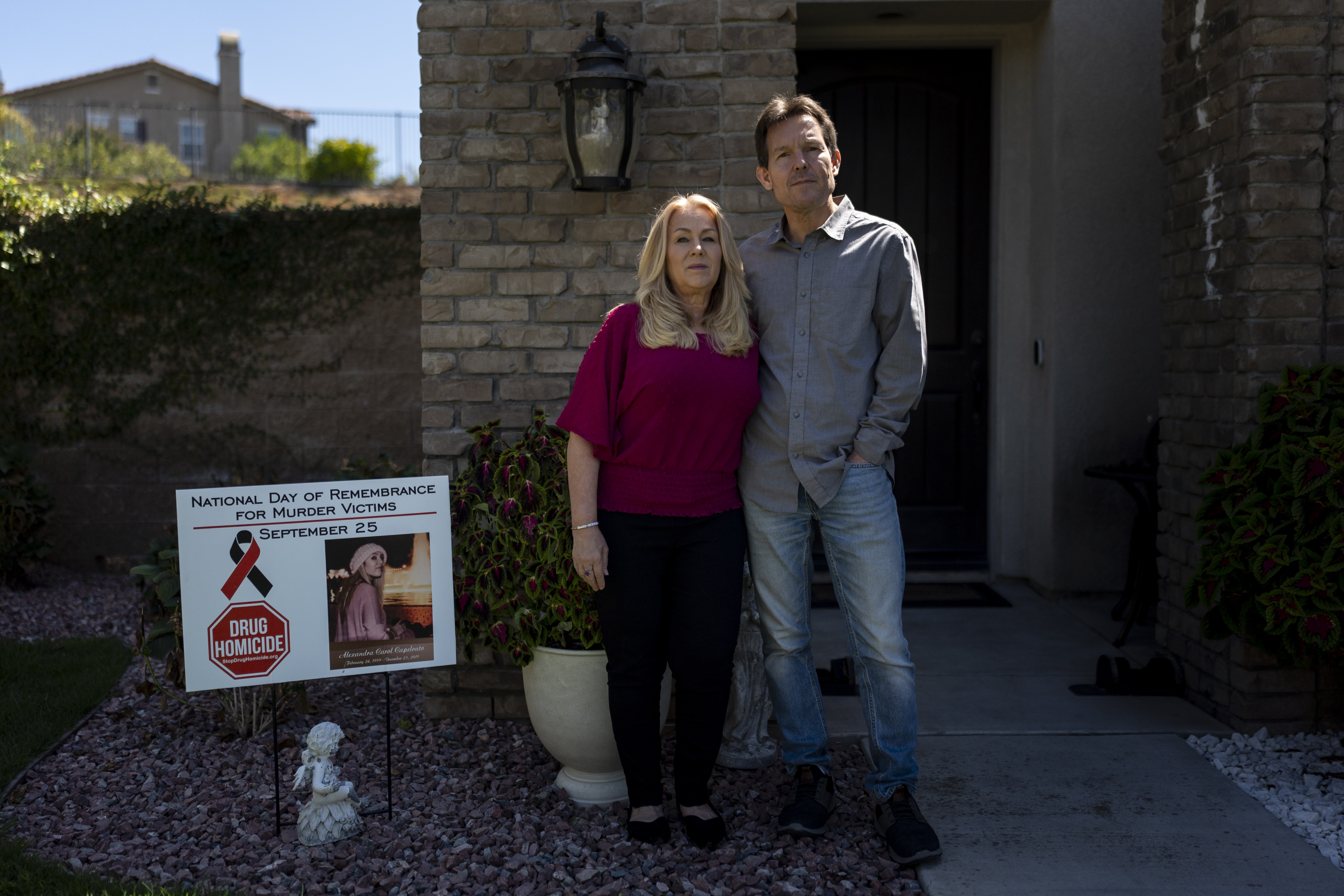 Matt Capelouto and his wife, Christine, whose daughter, Alexandra, died from a fentanyl overdose, stand for a photo outside their home in Temecula, Calif., Tuesday, Sept. 17, 2024. (AP Photo/Jae C. Hong)