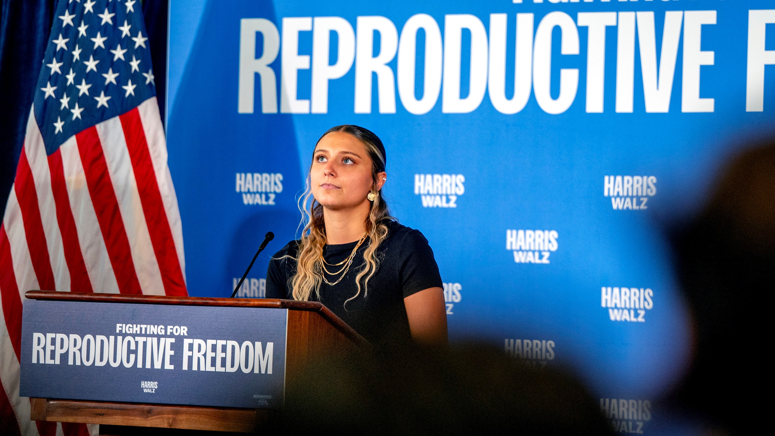 Hadley Duvall, a sexual assault survivor and reproductive rights advocate who spoke at the Democratic National Convention, joins a rally for Vice President Harris at the Independence Visitor Center in Philadelphia, Sunday, Sept. 15, 2024. Gov. Josh Shapiro headlined the reproductive rights rally before the campaign's national "Fighting for Reproductive Freedom" bus departed on a tour across Pennsylvania. (Tom Gralish/The Philadelphia Inquirer via AP)