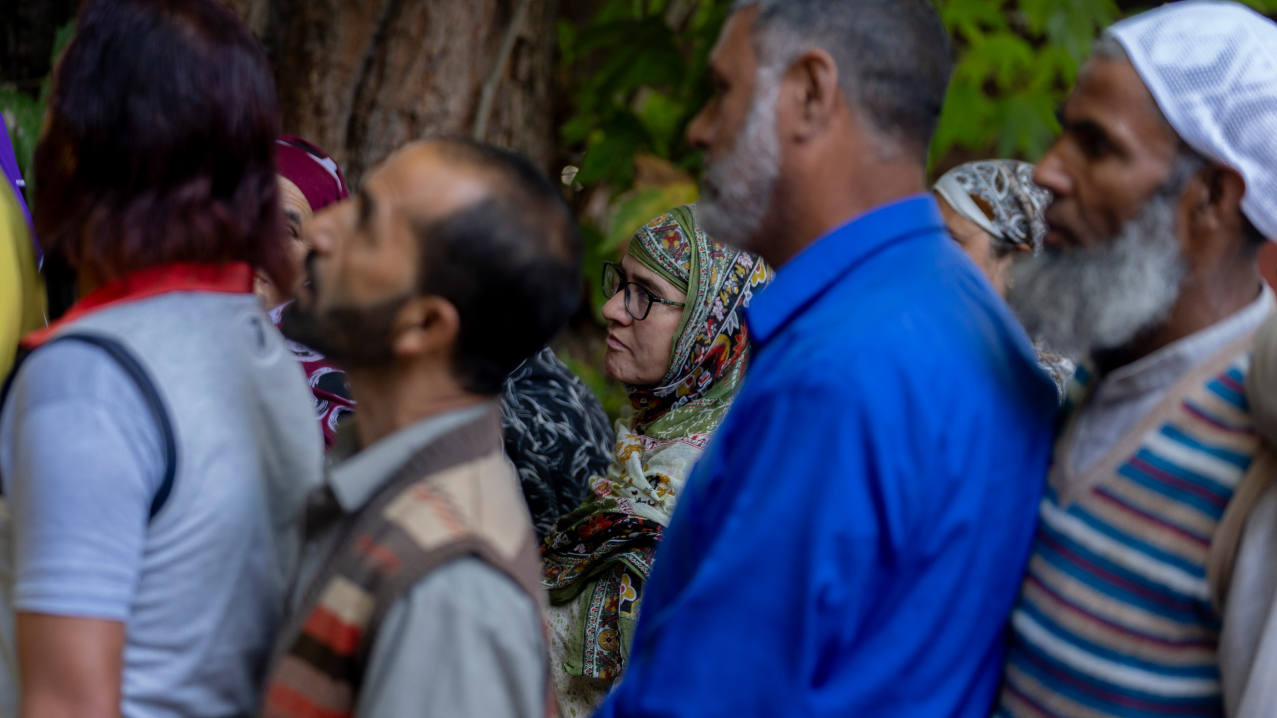 People queue up at a polling booth to cast their vote in Naira, south of Srinagar, Indian controlled Kashmir, Wednesday, Sept. 18, 2024. (AP Photo/Dar Yasin)