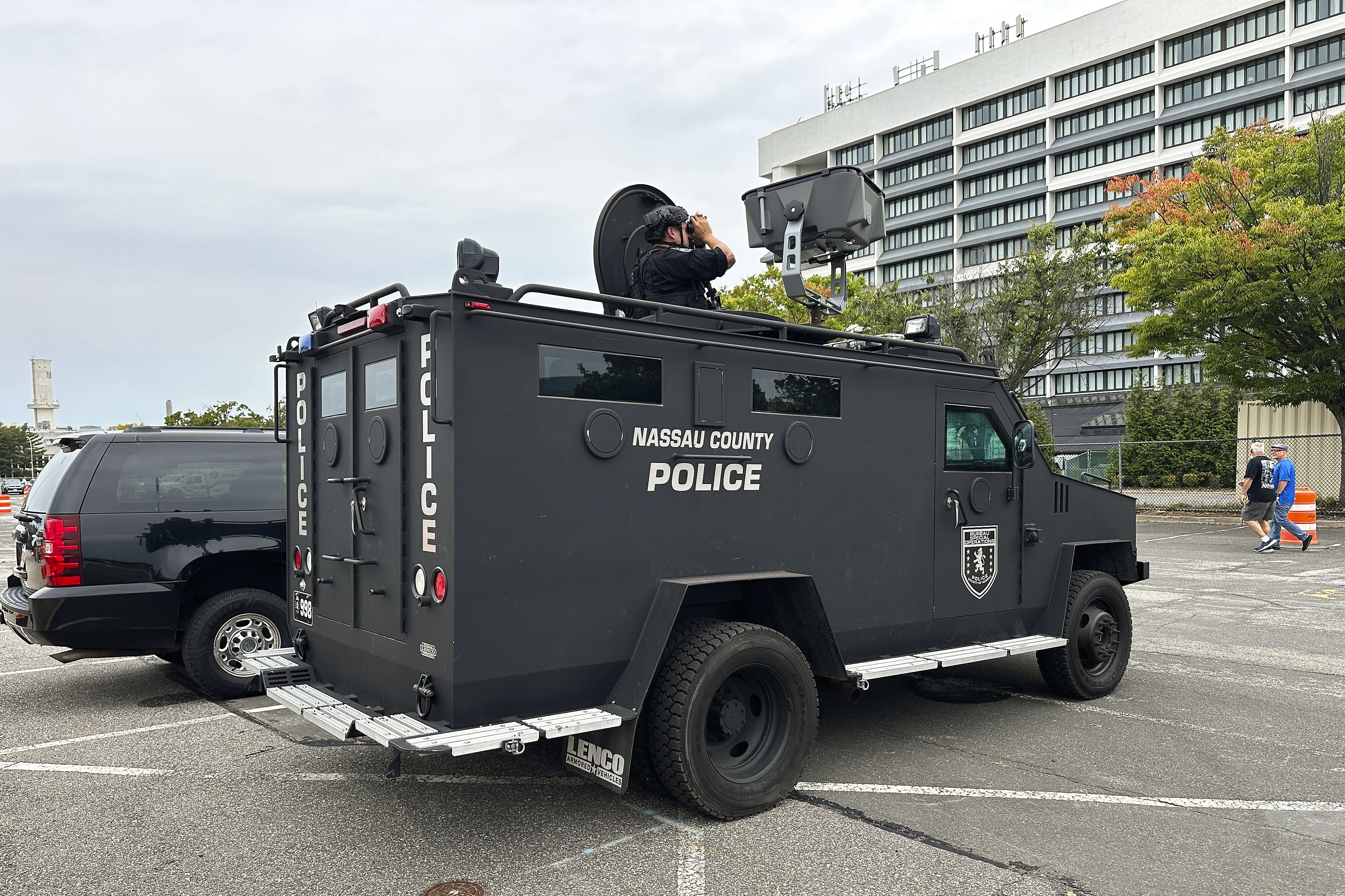 Nassau County Police scan buildings surrounding Nassau Coliseum before the start of a rally featuring Republican presidential nominee former President Donald Trump, Wednesday, Sept. 18, 2024, in Uniondale, N.Y. (AP Photo/Ted Shaffrey)