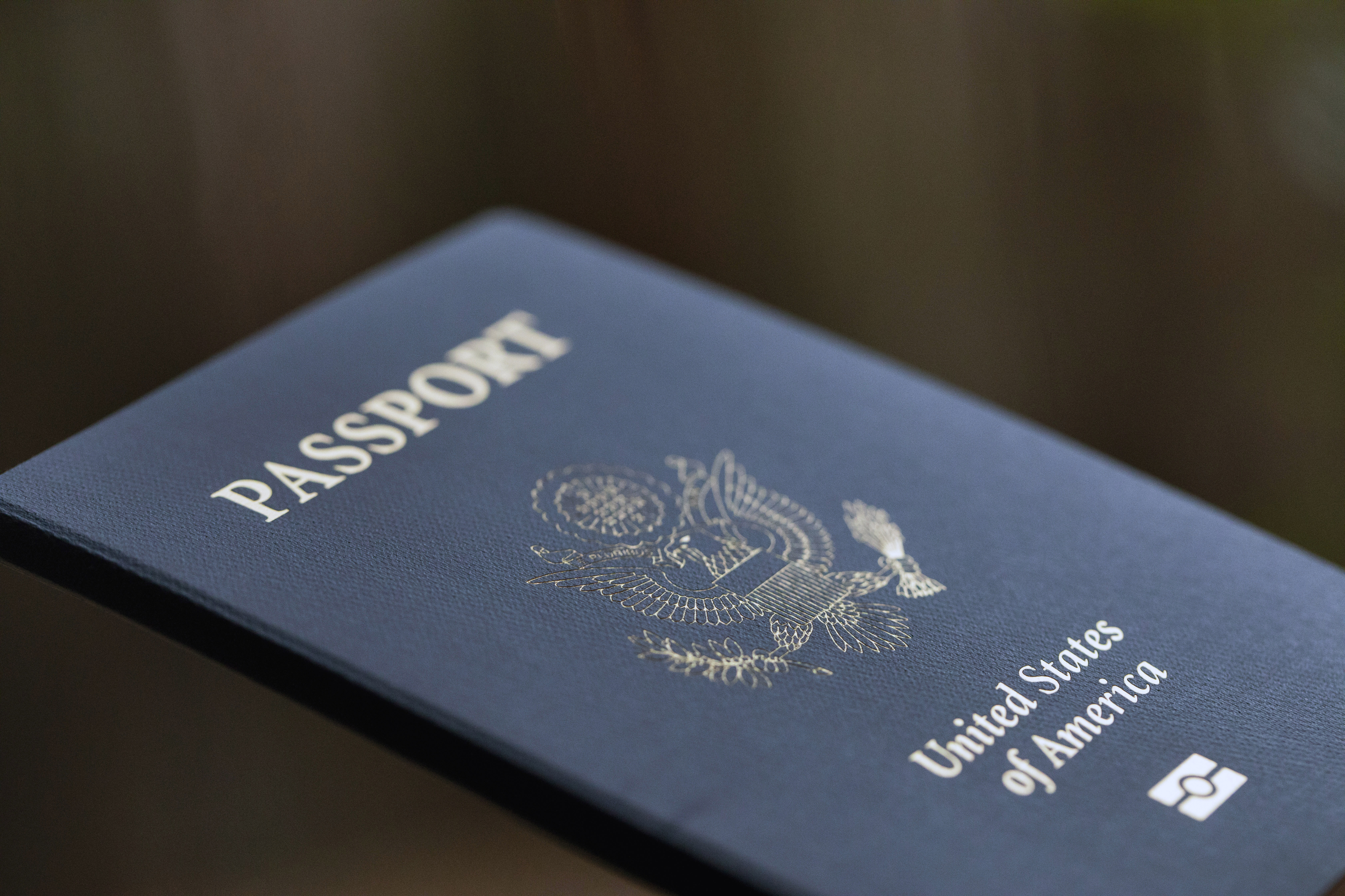 FILE - The cover of a U.S. Passport is displayed in Tigard, Ore., Dec. 11, 2021. Americans can now renew their passports online, bypassing a cumbersome mail-in paper application process that often caused delays. The State Department announced Wednesday that its online passport renewal system is now fully operational. (AP Photo/Jenny Kane, File)