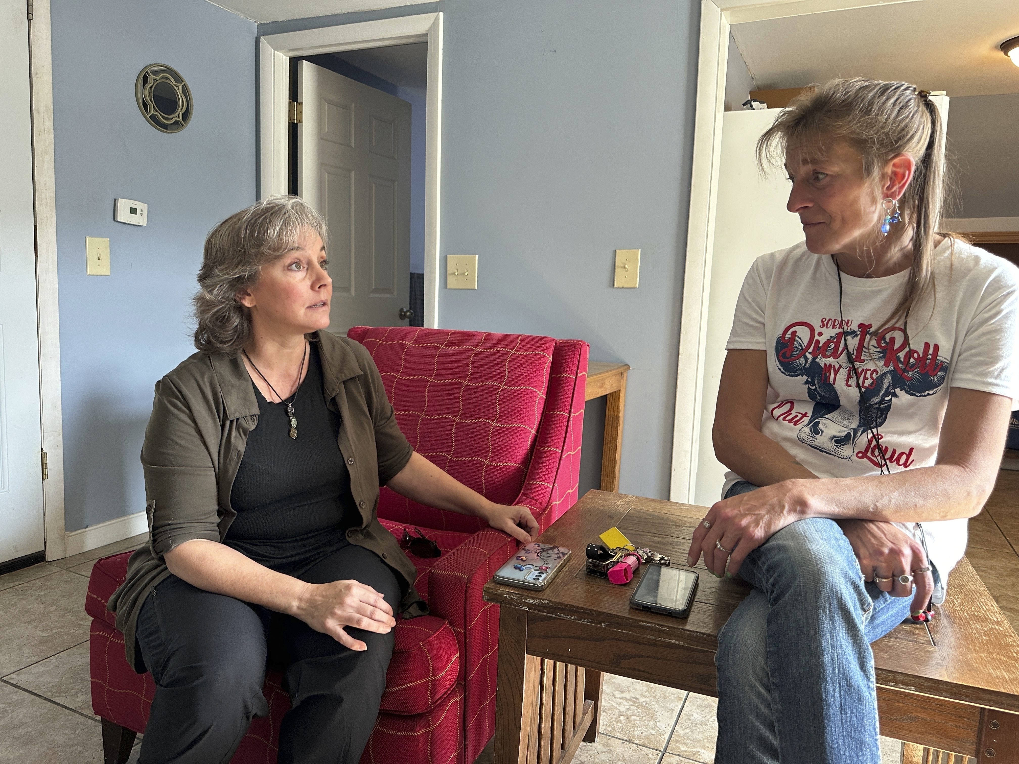 Heidi Wright, right, who is experiencing homelessness and must leave her state-funded motel room by Sept. 28, 2024, talks to Jen Armbrister, an outreach case manager for the Good Samaritan Haven in Barre, Vt., on Wednesday, Sept. 18, 2024. (AP Photo/Lisa Rathke)