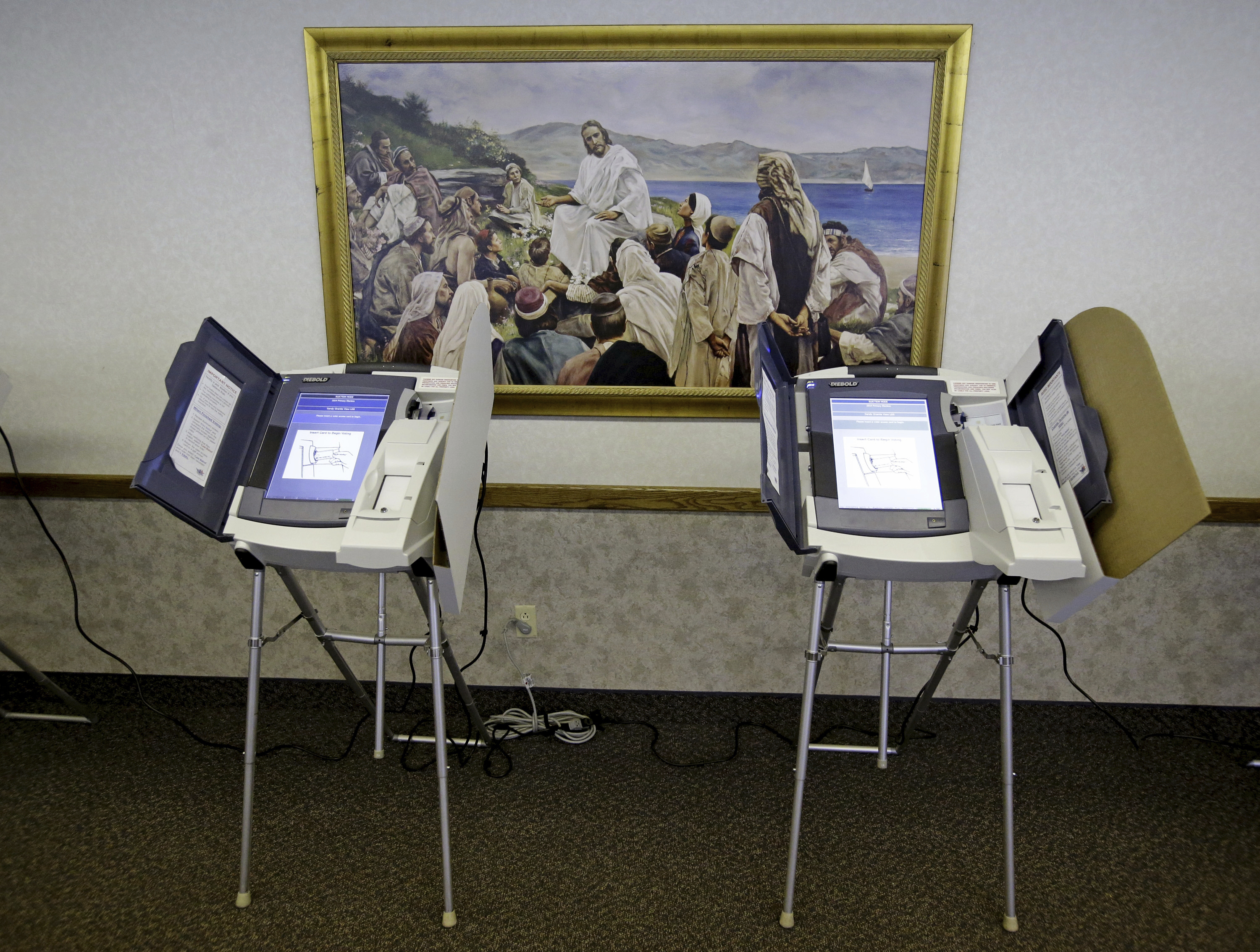 FILE - The polling station at the Sandy Granite View Church of Jesus Christ of Latter-Day Saints is shown, June 24, 2014, in Sandy, Utah. Vice President Kamala Harris is stepping up her efforts to win over voters who belong to the Church of Jesus Christ of Latter-day Saints, enlisting prominent members of the faith to make the case in the battleground state of Arizona that Donald Trump doesn’t align with the church’s values. Harris’ Arizona campaign on Thursday unveiled its Latter-day Saints for Harris-Walz Advisory Committee to formalize its work to engage current and former members of the church, widely known as the Mormon church. (AP Photo/Rick Bowmer, File)