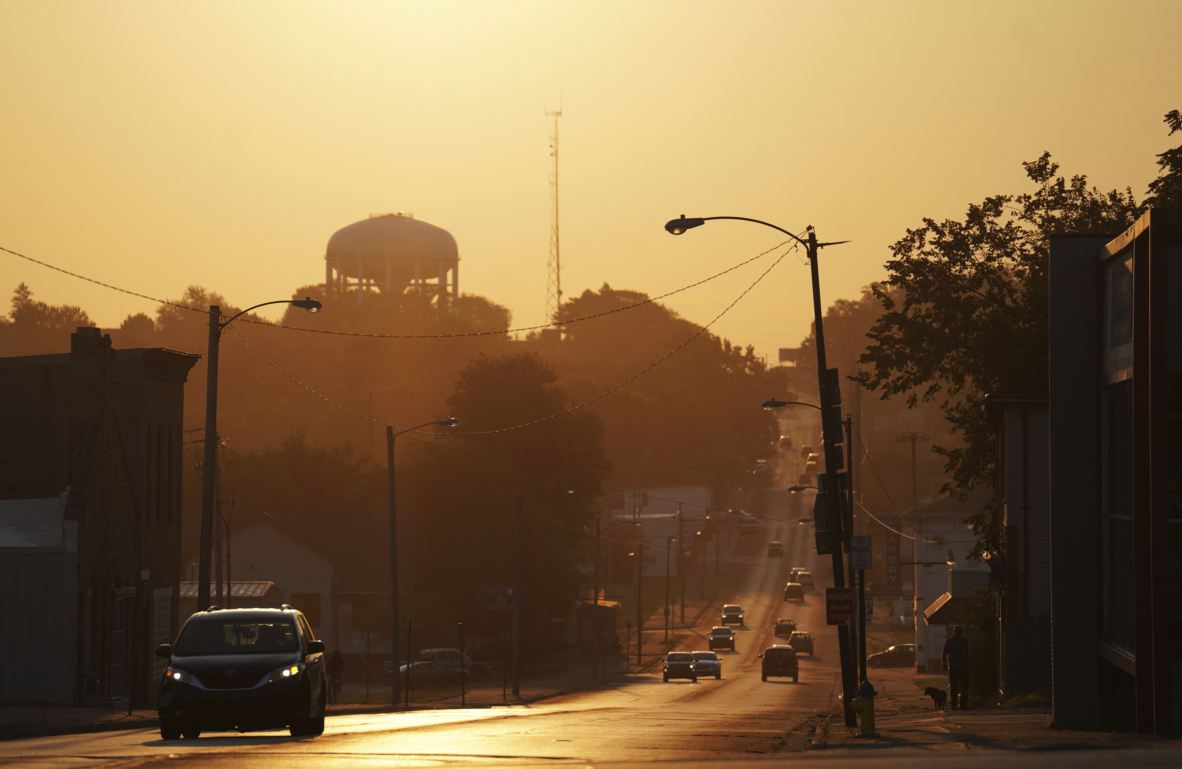 The sun rises over the city of Springfield, Ohio, Monday, Sept. 16, 2024. (AP Photo/Jessie Wardarski)