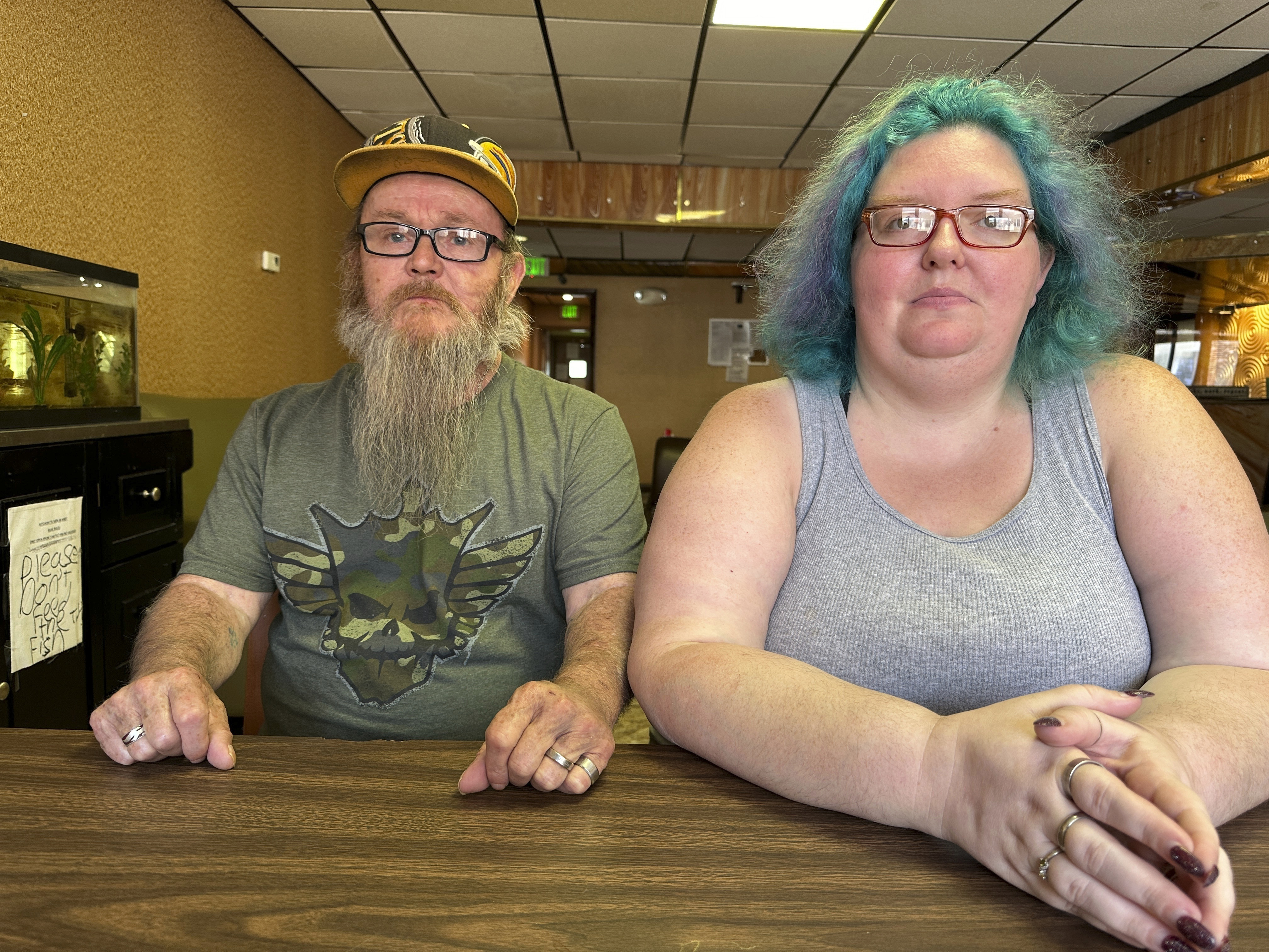 Bruce and Nova Jewett, who are experiencing homelessness, sit at the Hilltop Inn in Berlin, Vt., on Wednesday, Sept. 18, 2024, where they have been living and will have to leave by Oct. 1, 2024. (AP Photo/Lisa Rathke)