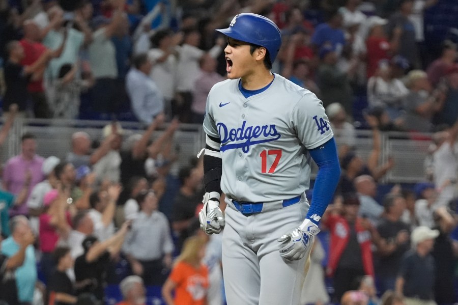 Los Angeles Dodgers' Shohei Ohtani (17) reacts after hitting his 50th home run of the season during the seventh inning of a baseball game against the Miami Marlins, Thursday, Sept. 19, 2024, in Miami. (AP Photo/Marta Lavandier)