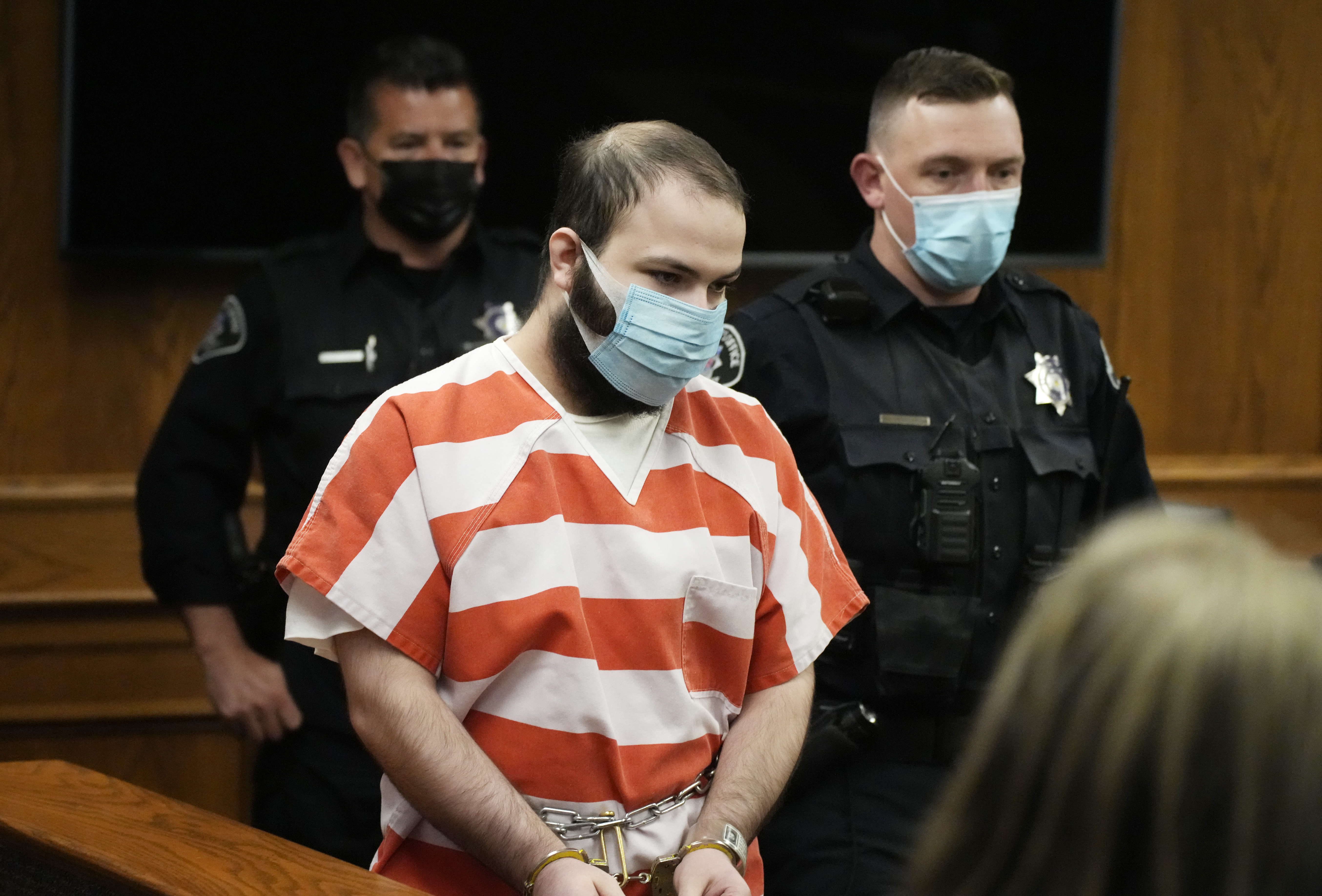 FILE - Ahmad Al Aliwi Alissa, accused of killing 10 people at a Colorado supermarket in March 2021, is led into a courtroom for a hearing, Sept. 7, 2021, in Boulder, Colo. (AP Photo/David Zalubowski, Pool, File)