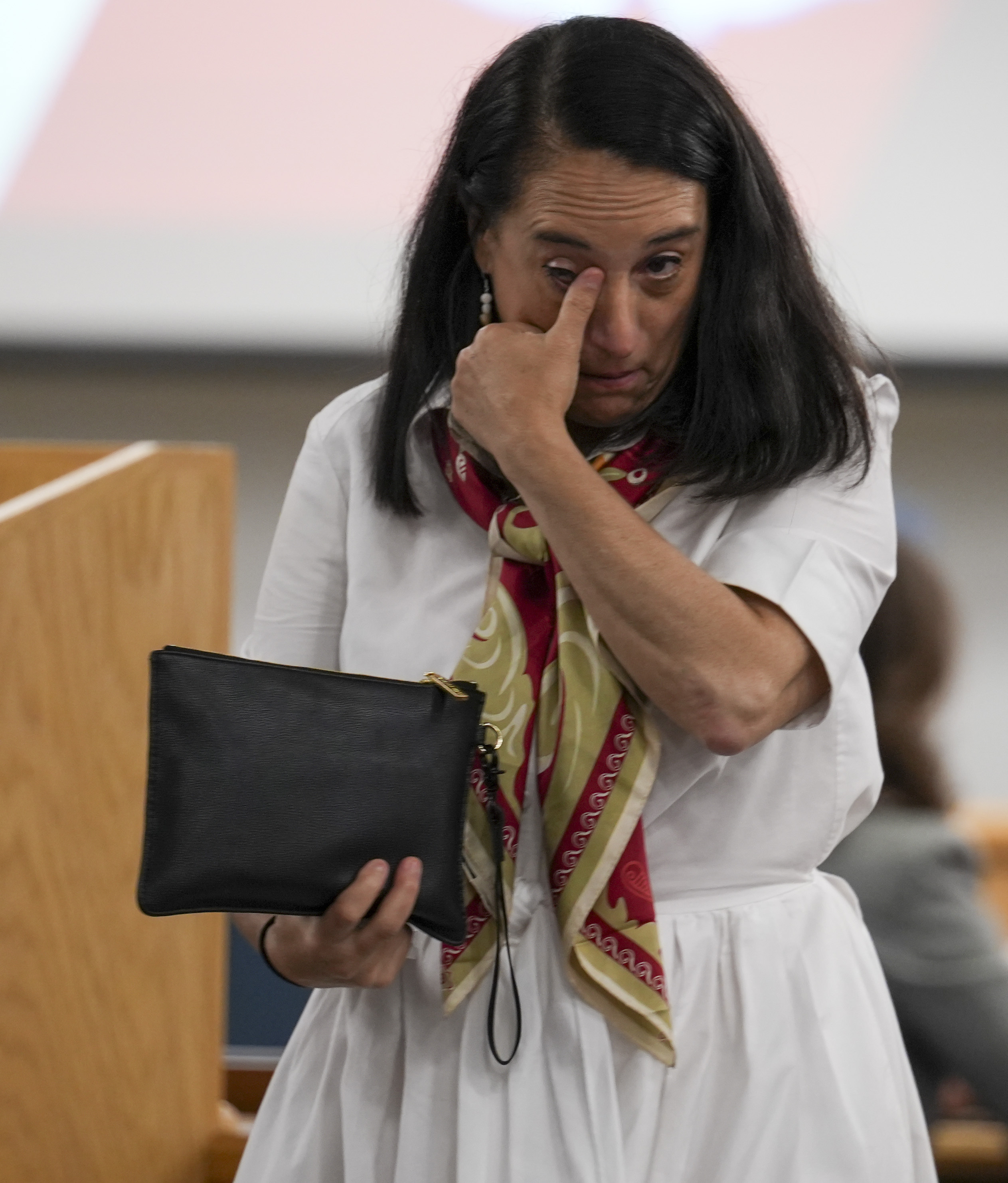 Renata Rojas, OceanGate mission specialist, wipes tears away during testimony at the Titan marine board formal hearing inside the Charleston County Council Chambers, Thursday, Sept. 19, 2024, in North Charleston, S.C. (Corey Connor via AP, Pool)