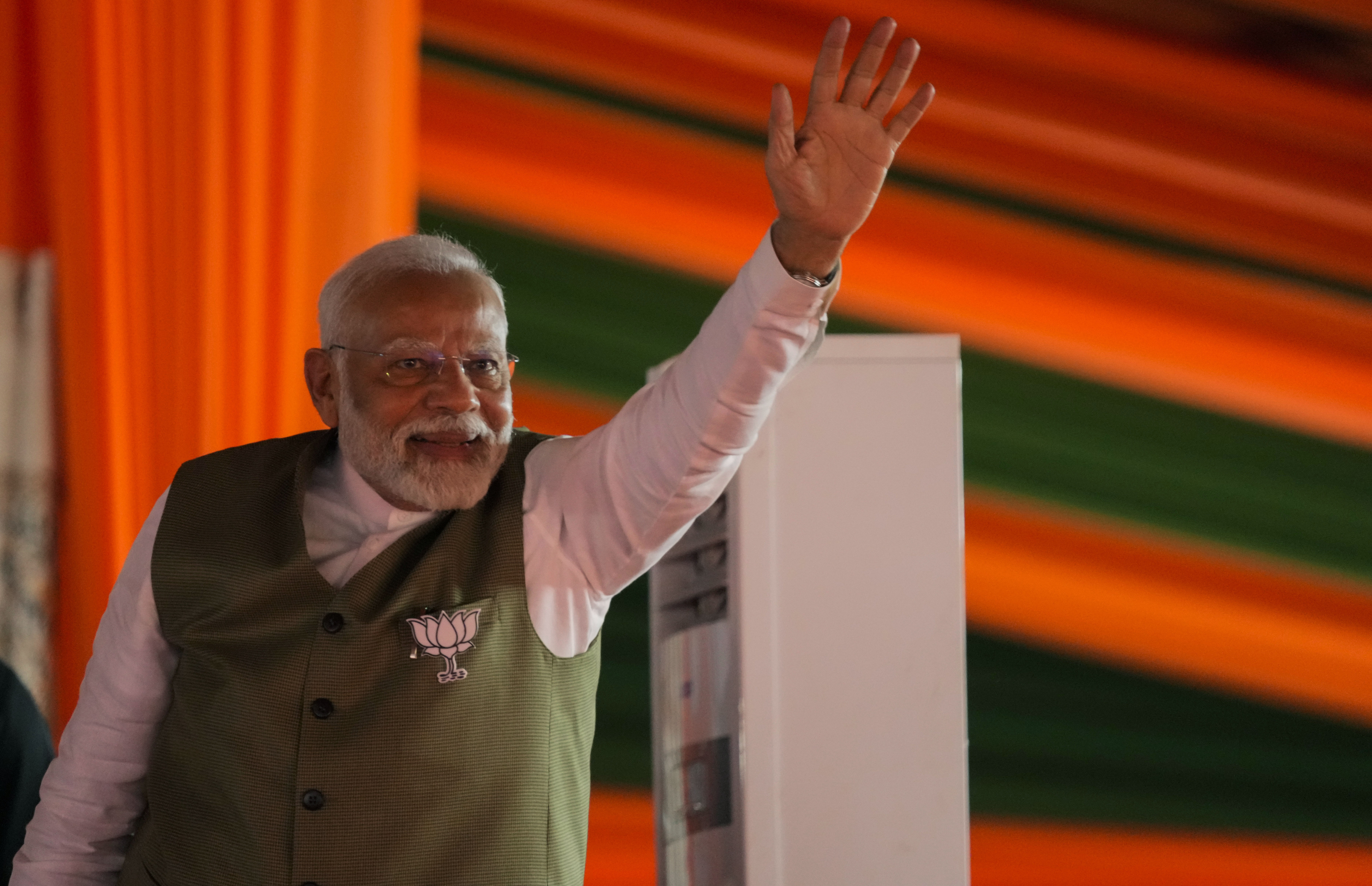 Indian Prime Minister Narendra Modi waves towards the crowd as he arrives to address the election rally in Srinagar, Indian controlled Kashmir, Thursday, Sept. 19, 2024. (AP Photo/Mukhtar Khan)