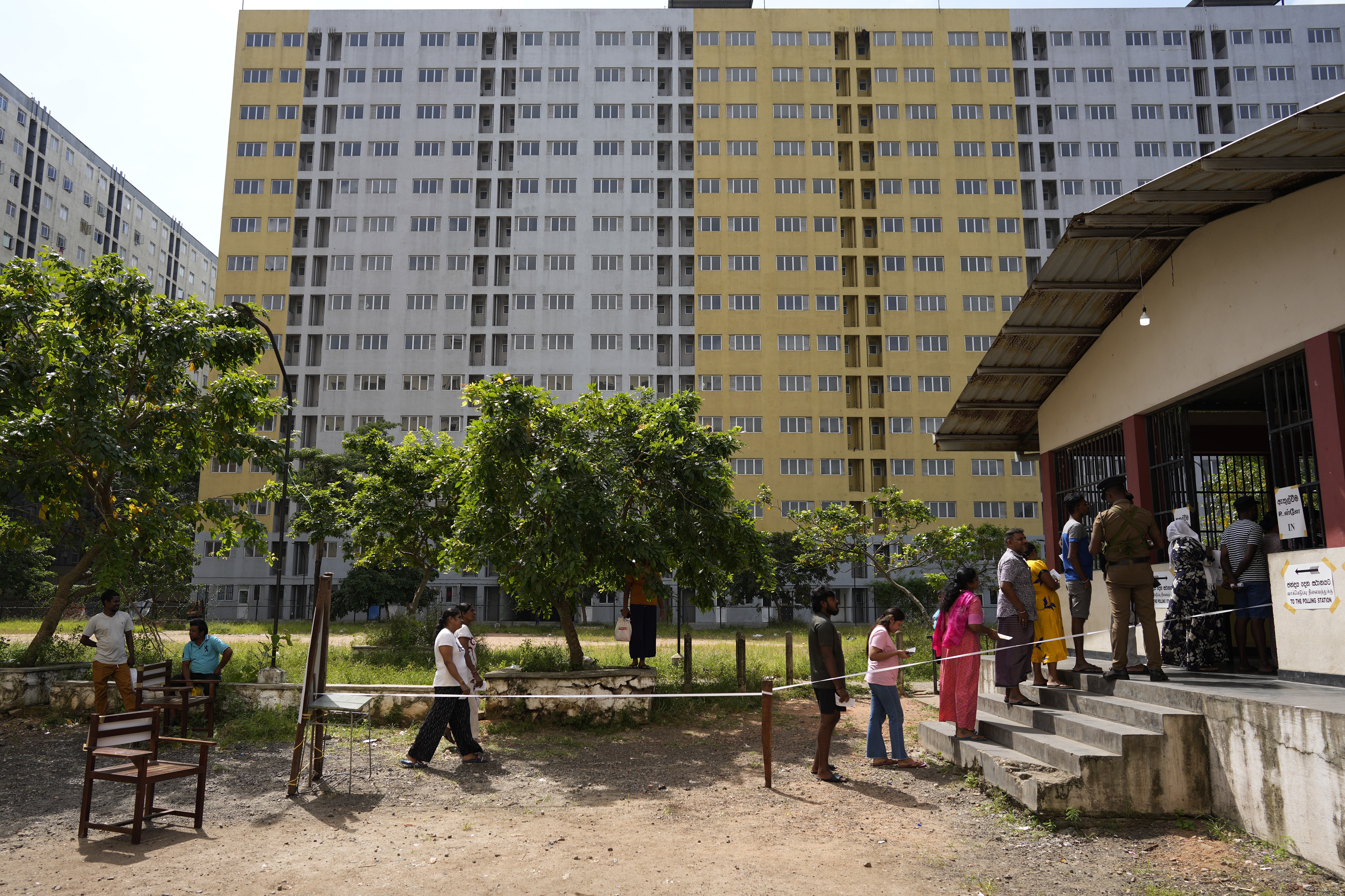 Voters gather at a polling station to cast their votes during the presidential election in Colombo, Sri Lanka, Saturday, Sept. 21, 2024. (AP Photo/Eranga Jayawardena)