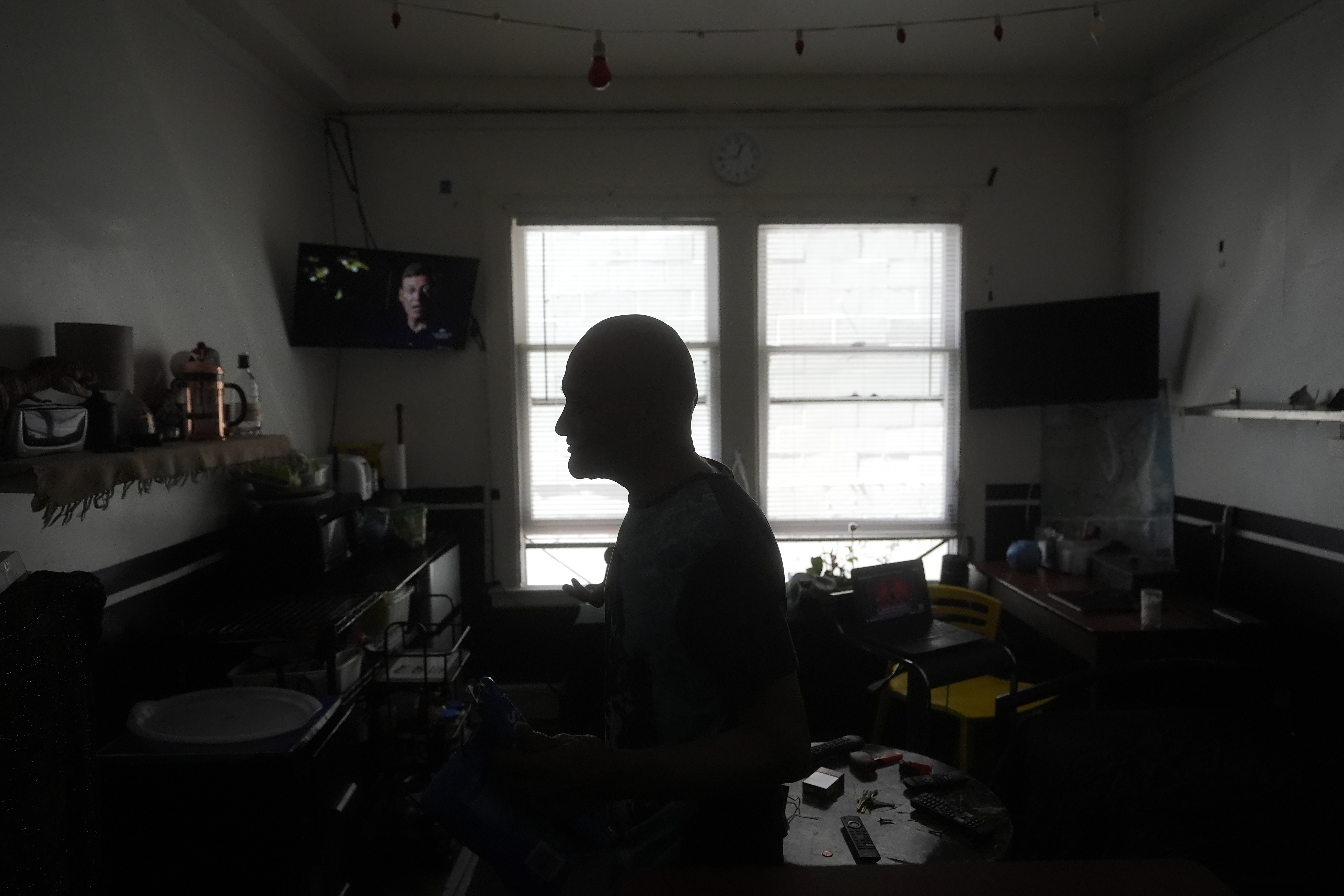 David Labogin is interviewed in his Five Keys transitional housing room in San Francisco, Monday, Aug. 26, 2024. (AP Photo/Jeff Chiu)