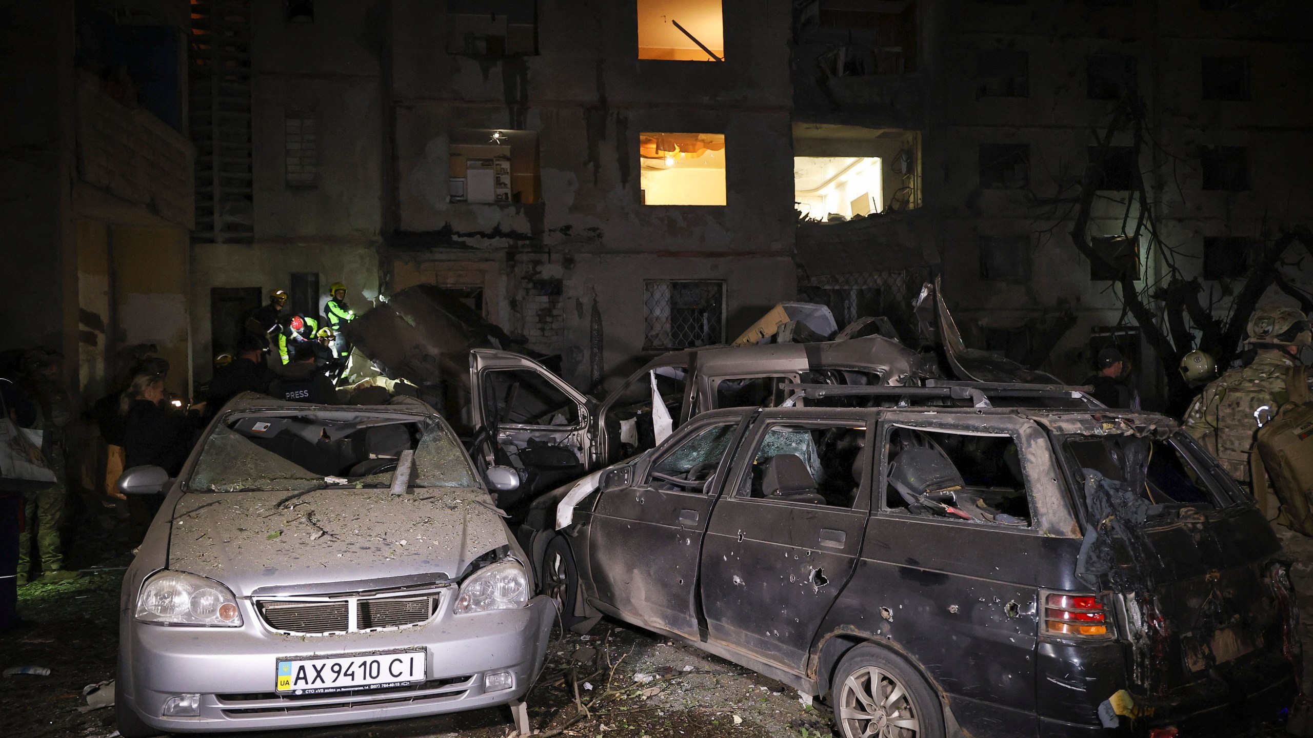 Emergency services workers move rubble after a Russian strike on a residential building in Kharkiv, Ukraine early Sunday Sept. 22, 2024. (Kharkiv Regional Military Administration via AP)