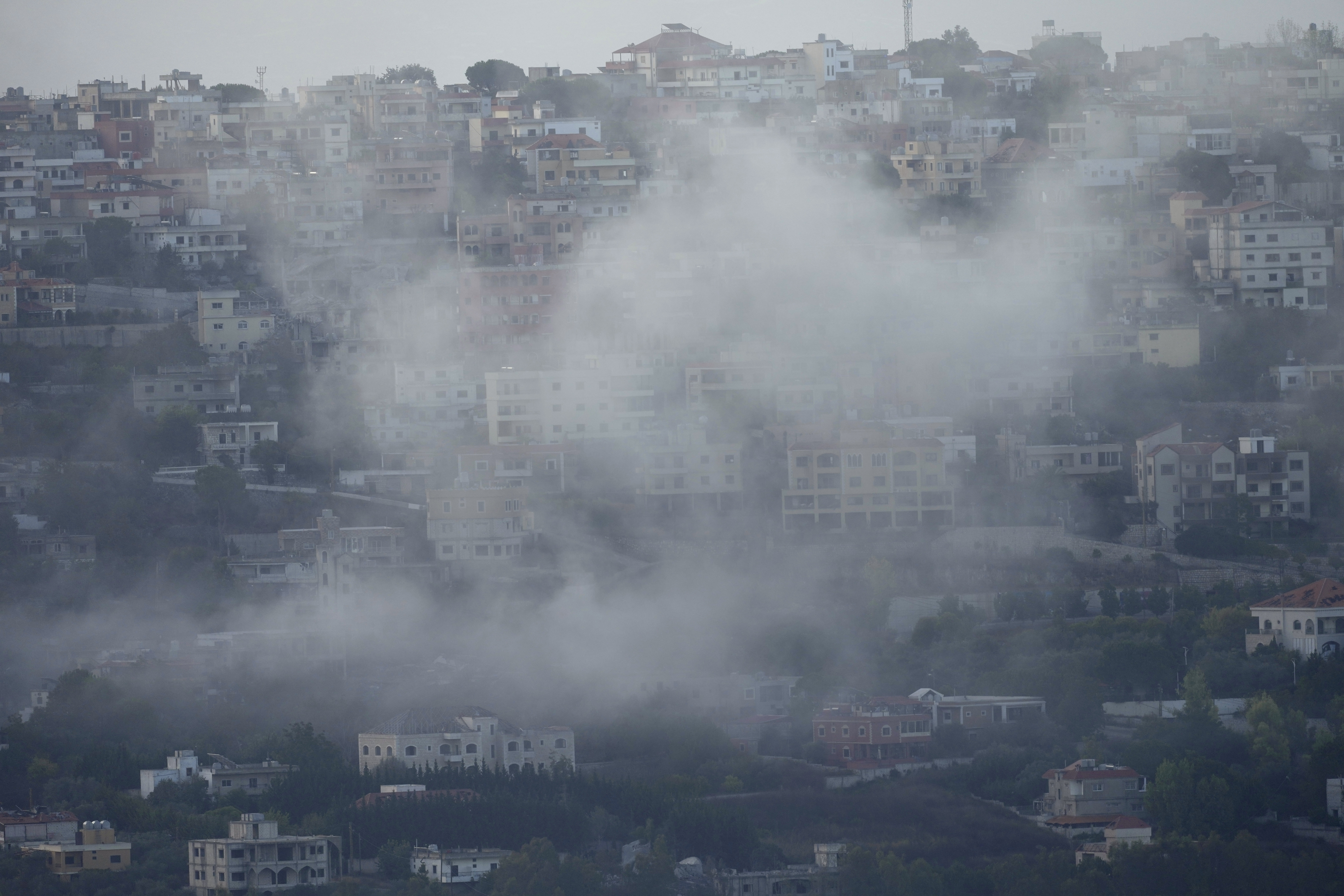 Smoke rises from an Israeli airstrike on Khiam village, as seen from Marjayoun town, south Lebanon, Monday, Sept. 23, 2024. (AP Photo/Hussein Malla)