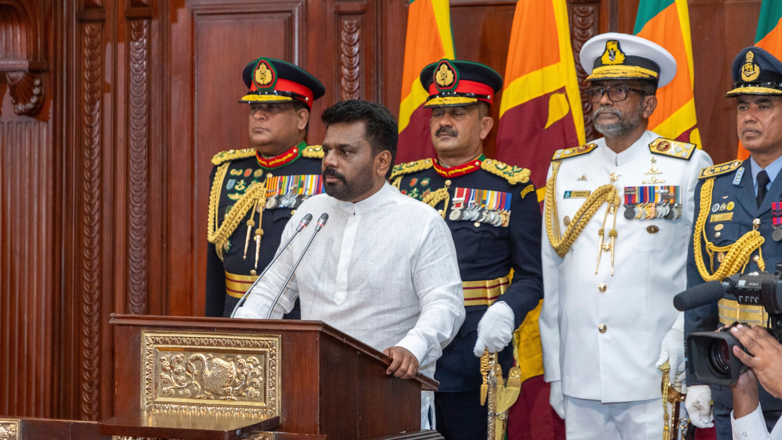 Commanders of the security forces stand behind as Sri Lanka's new president Anura Kumara Dissanayake, addresses a gathering after he was sworn in at the Sri Lankan President's Office in Colombo, Sri Lanka, Monday, Sept.23, 2024. (Sri Lankan President's Office via AP)