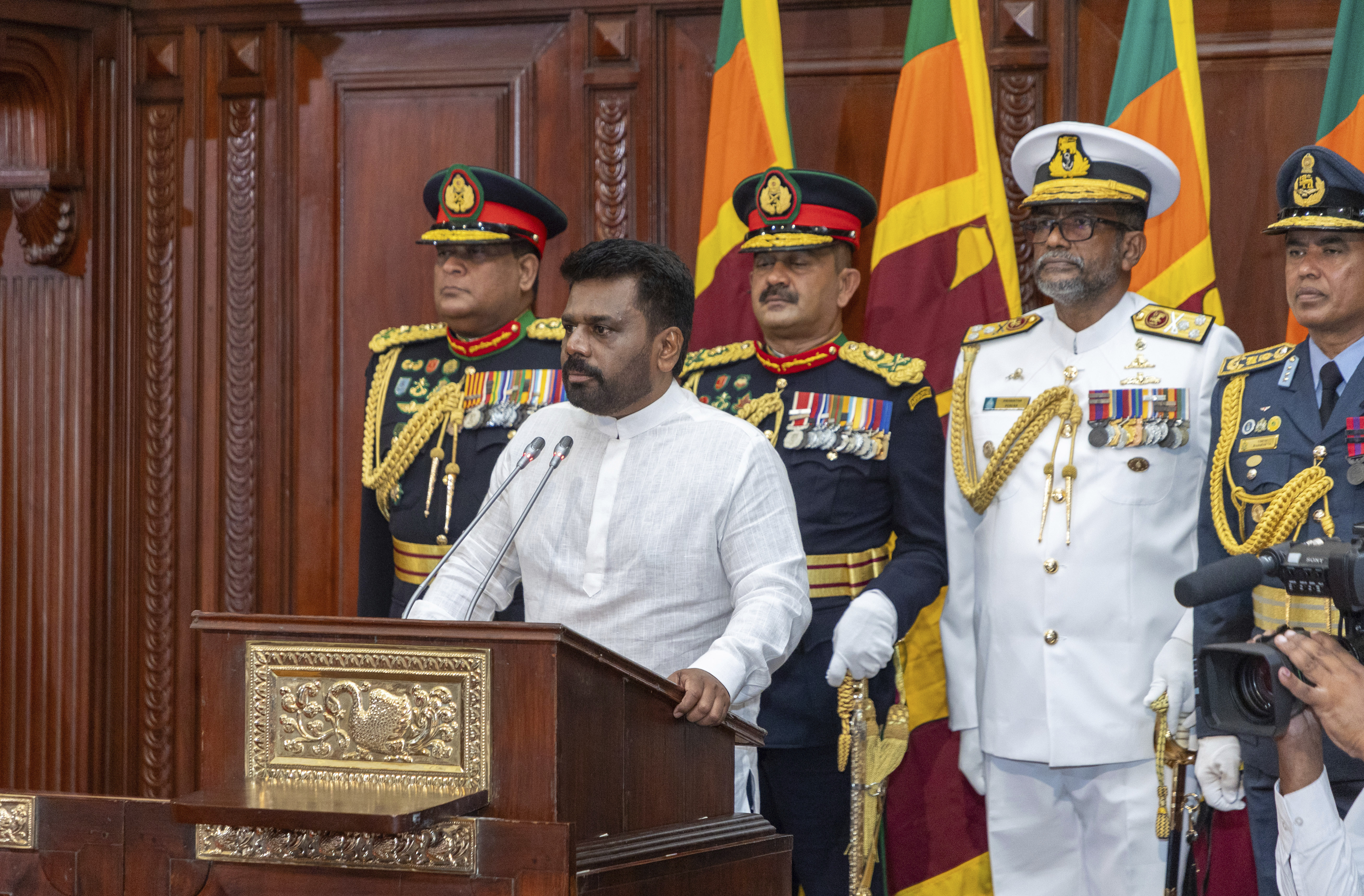 Commanders of the security forces stand behind as Sri Lanka's new president Anura Kumara Dissanayake, addresses a gathering after he was sworn in at the Sri Lankan President's Office in Colombo, Sri Lanka, Monday, Sept.23, 2024. (Sri Lankan President's Office via AP)