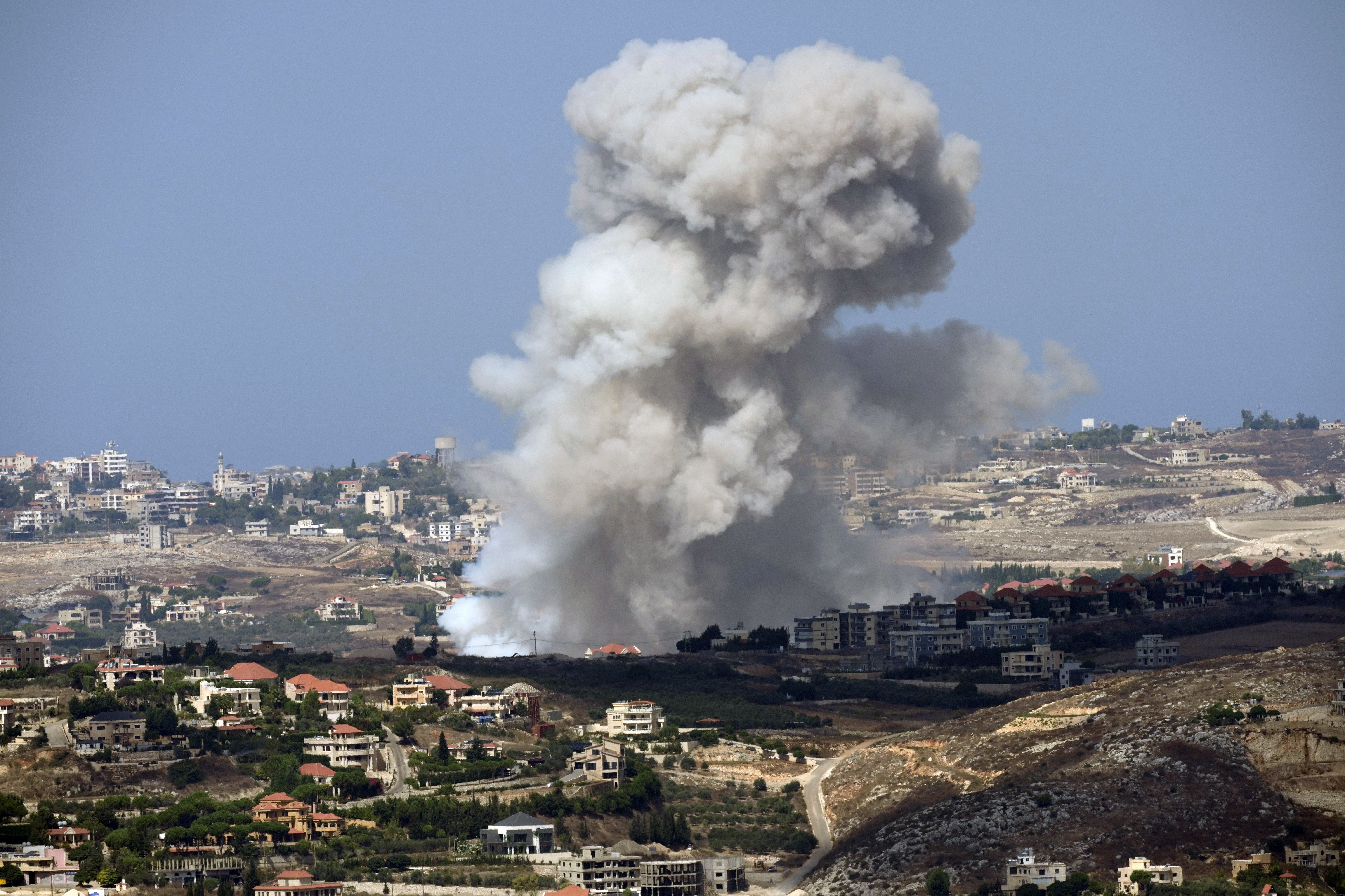 Smoke rises from Israeli shelling on villages in the Nabatiyeh district, seen from the southern town of Marjayoun, Lebanon, Monday, Sept. 23, 2024. (AP Photo/Hussein Malla)