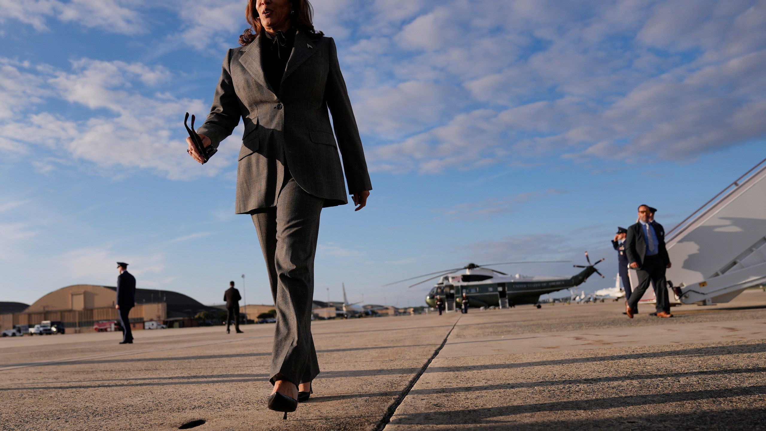 Democratic presidential nominee Vice President Kamala Harris walks over to speak to members of the media upon her arrival at Andrews Air Force Base, Md., Sunday, Sept. 22, 2024. (AP Photo/Matt Rourke/Pool)