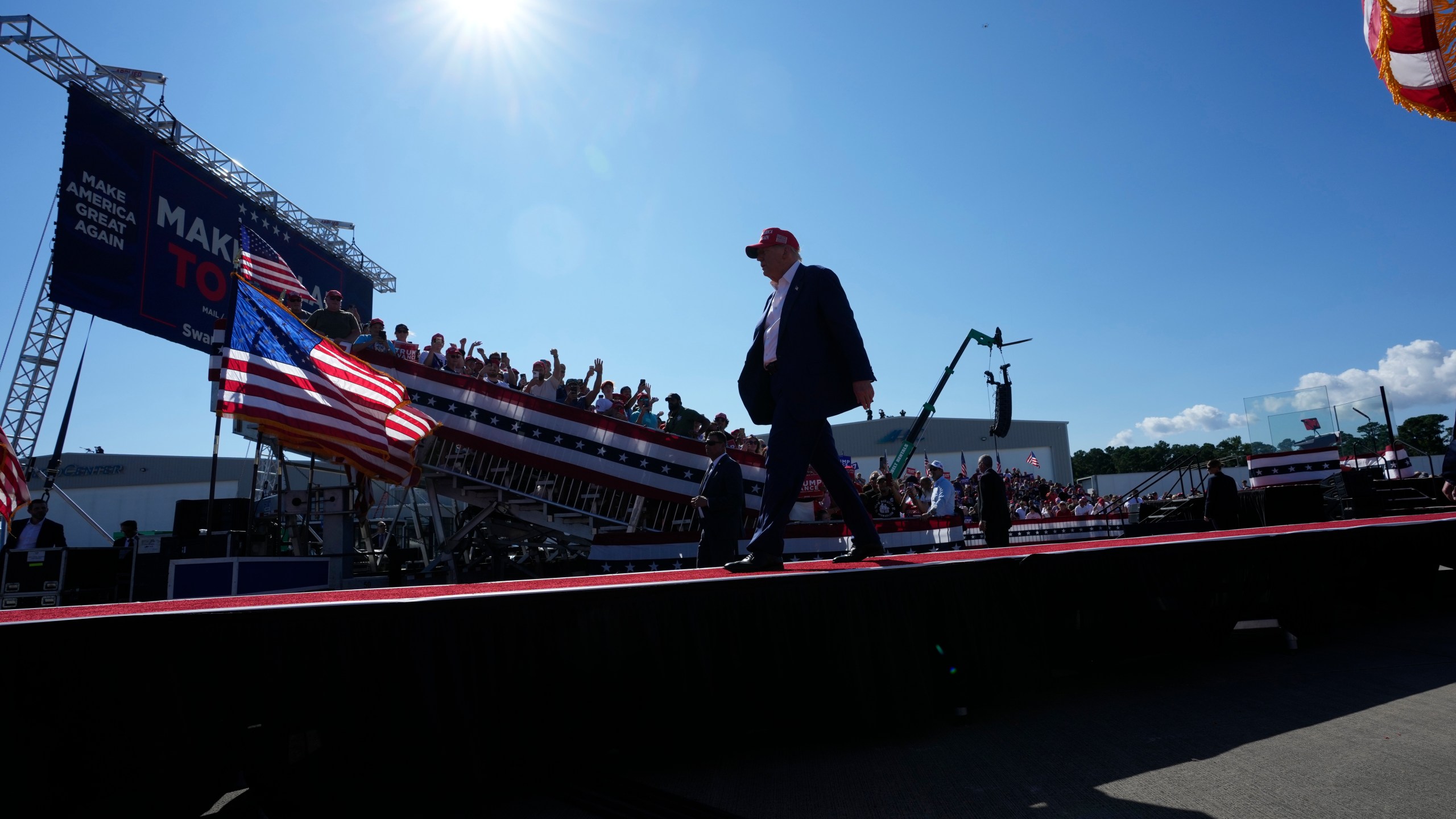 Republican presidential nominee former President Donald Trump walks from the stage after speaking at a campaign rally at Wilmington International Airport, Saturday, Sept. 21, 2024, in Wilmington, N.C. (AP Photo/Alex Brandon)