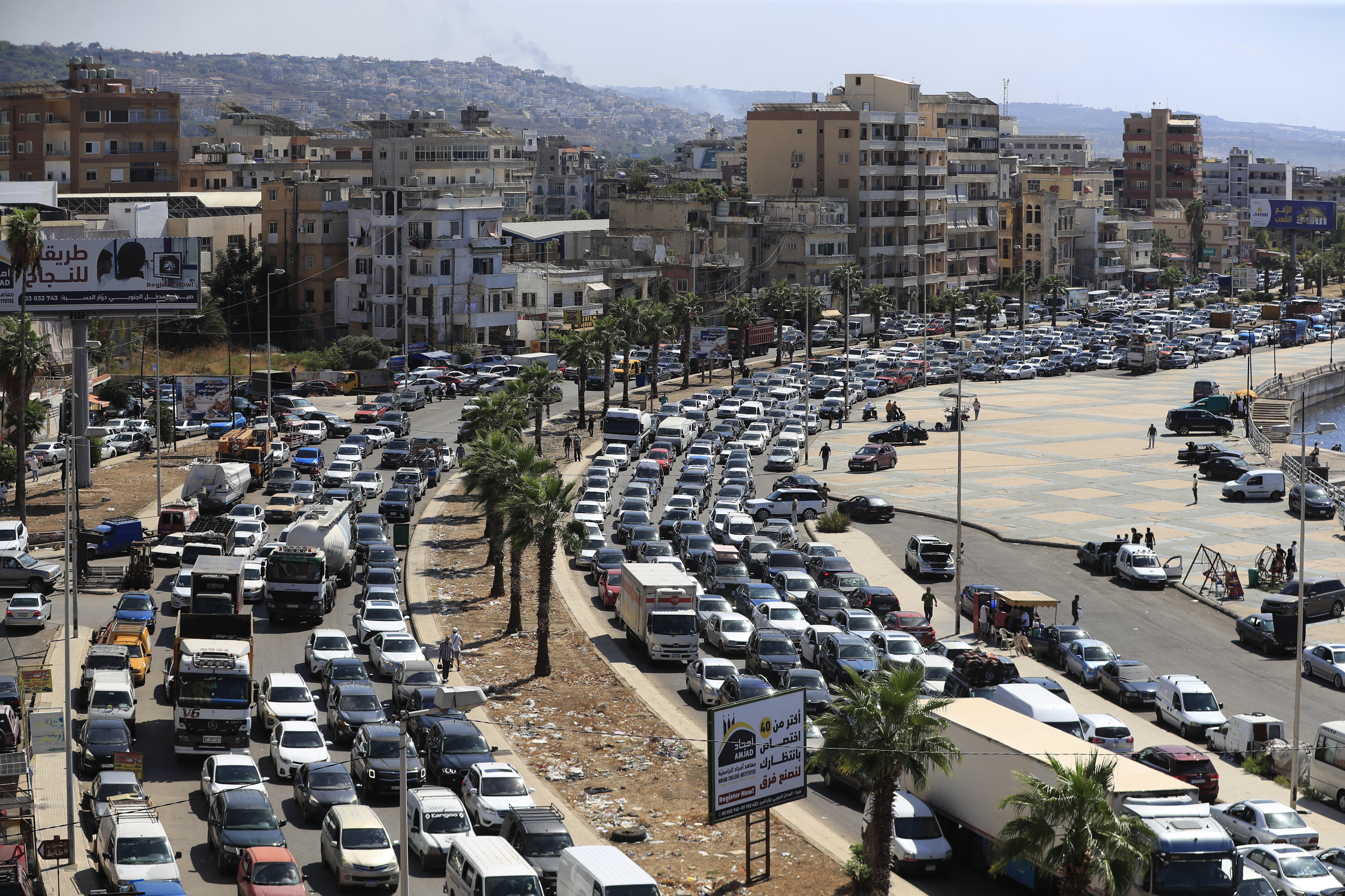 Cars sit in traffic as they flee the southern villages amid ongoing Israeli airstrikes, in Sidon, Lebanon, Monday, Sept. 23, 2024. (AP Photo/Mohammed Zaatari)