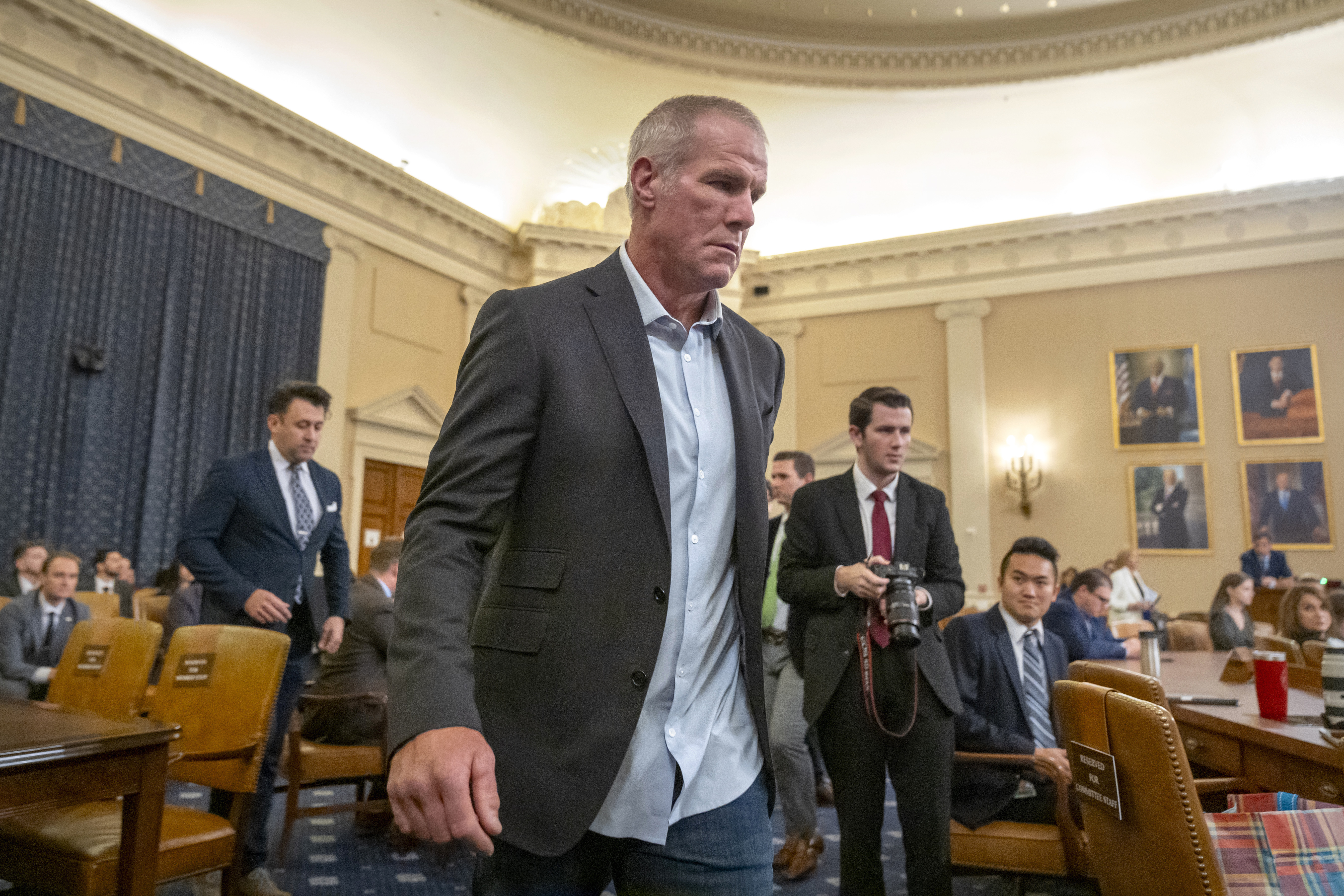 Former NFL quarterback Brett Favre arrives to appear before the House Committee on Ways and Means on Capitol Hill, Tuesday, Sept. 24, 2024, in Washington. (AP Photo/Mark Schiefelbein)