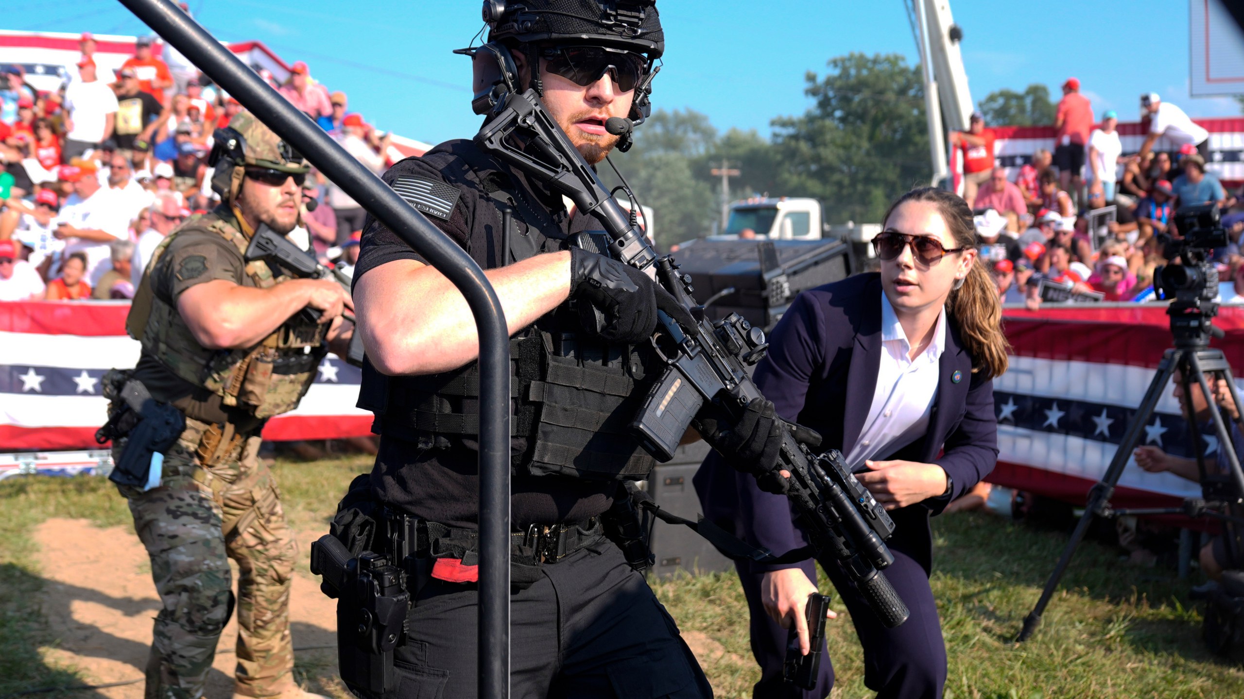 FILE - U.S. Secret Service agents respond as Republican presidential candidate former President Donald Trump is surrounded on stage by U.S. Secret Service agents at a campaign rally, July 13, 2024, in Butler, Pa. (AP Photo/Evan Vucci, File)