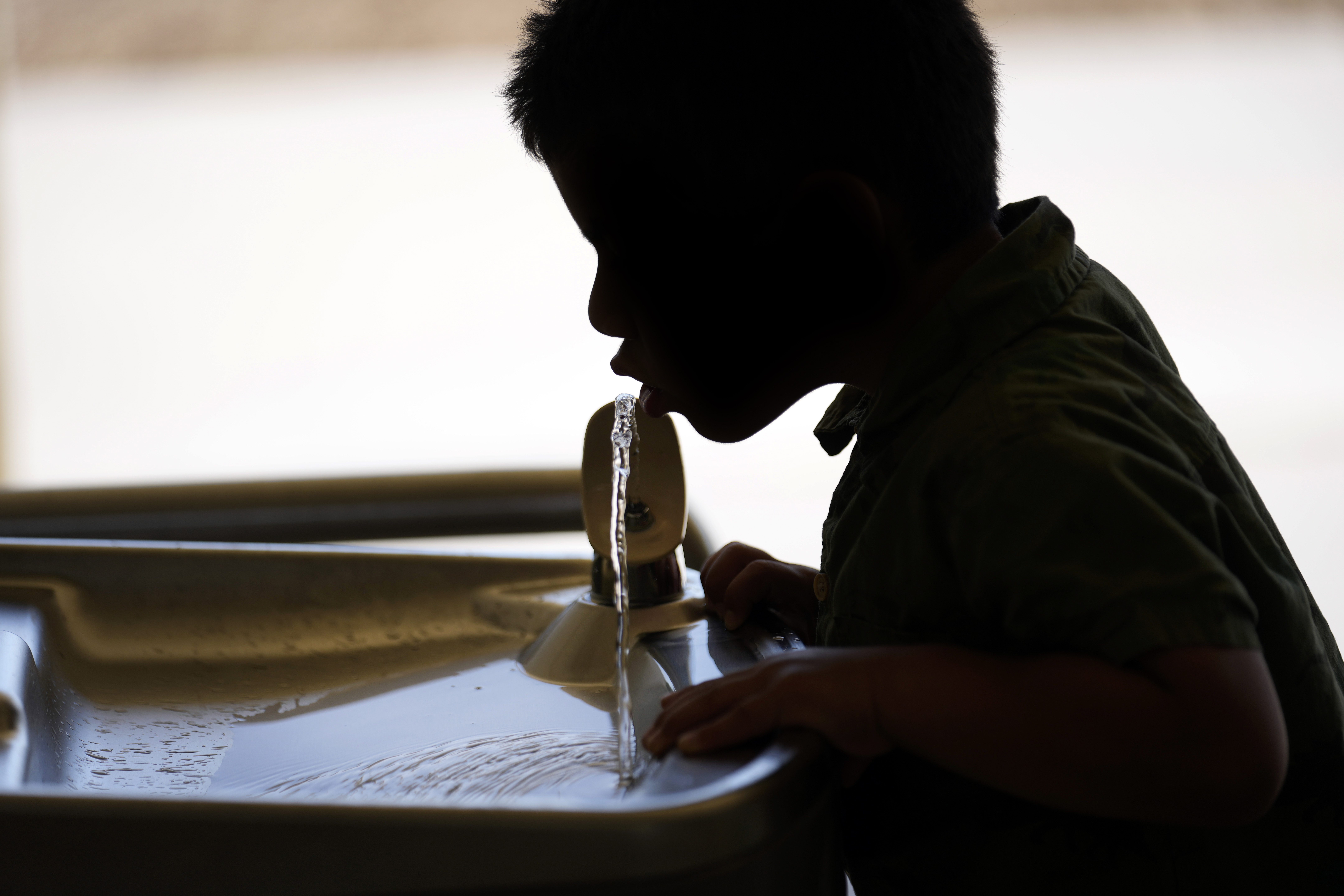 FILE - A student drinks from a water fountain at an elementary school in California on Sept. 20, 2023. (AP Photo/Marcio Jose Sanchez, File)