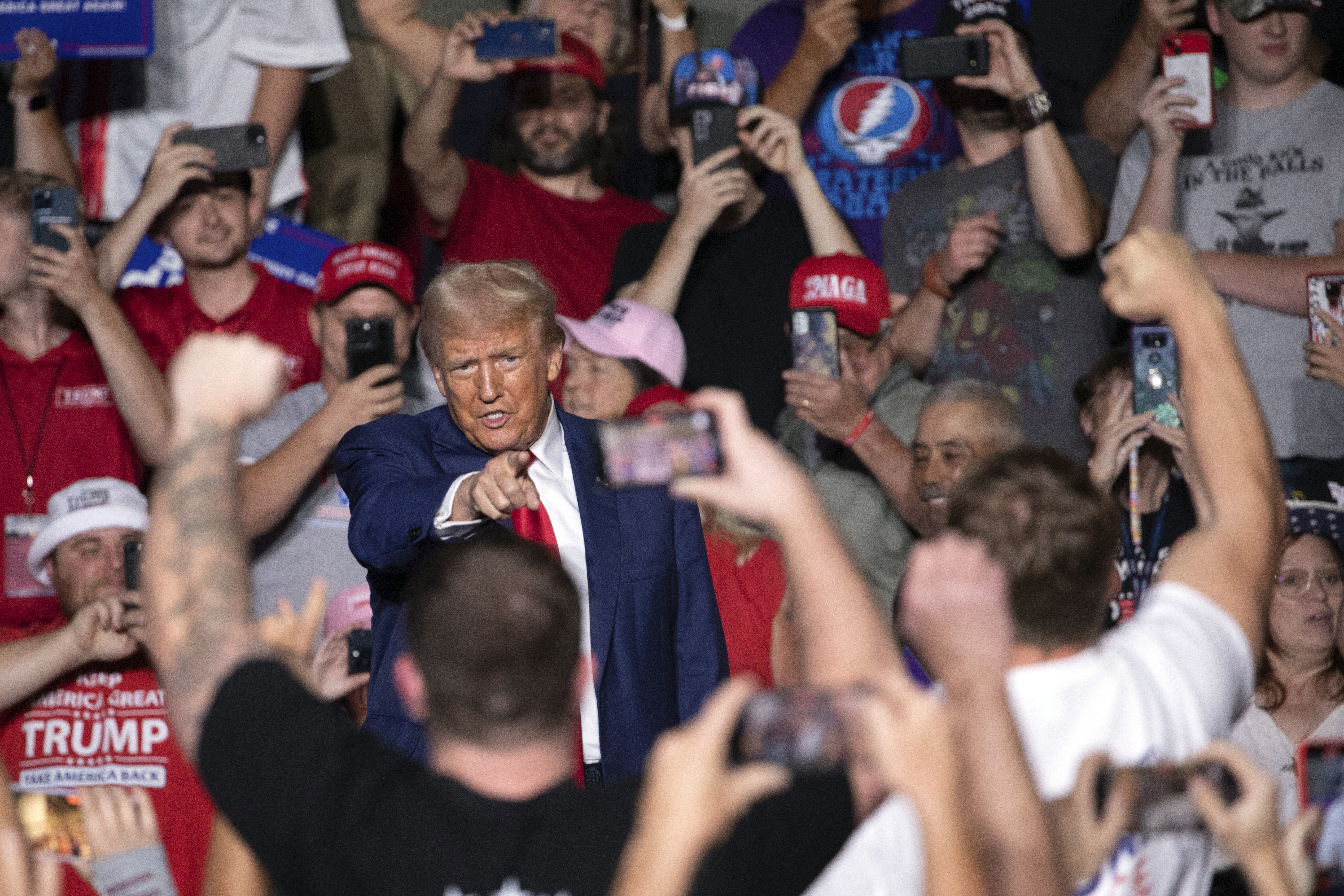 Republican presidential nominee former President Donald Trump points towards the crowd as he arrives for a campaign rally at Ed Fry Arena in Indiana, Pa., Monday, Sept. 23, 2024. (AP Photo/Rebecca Droke)