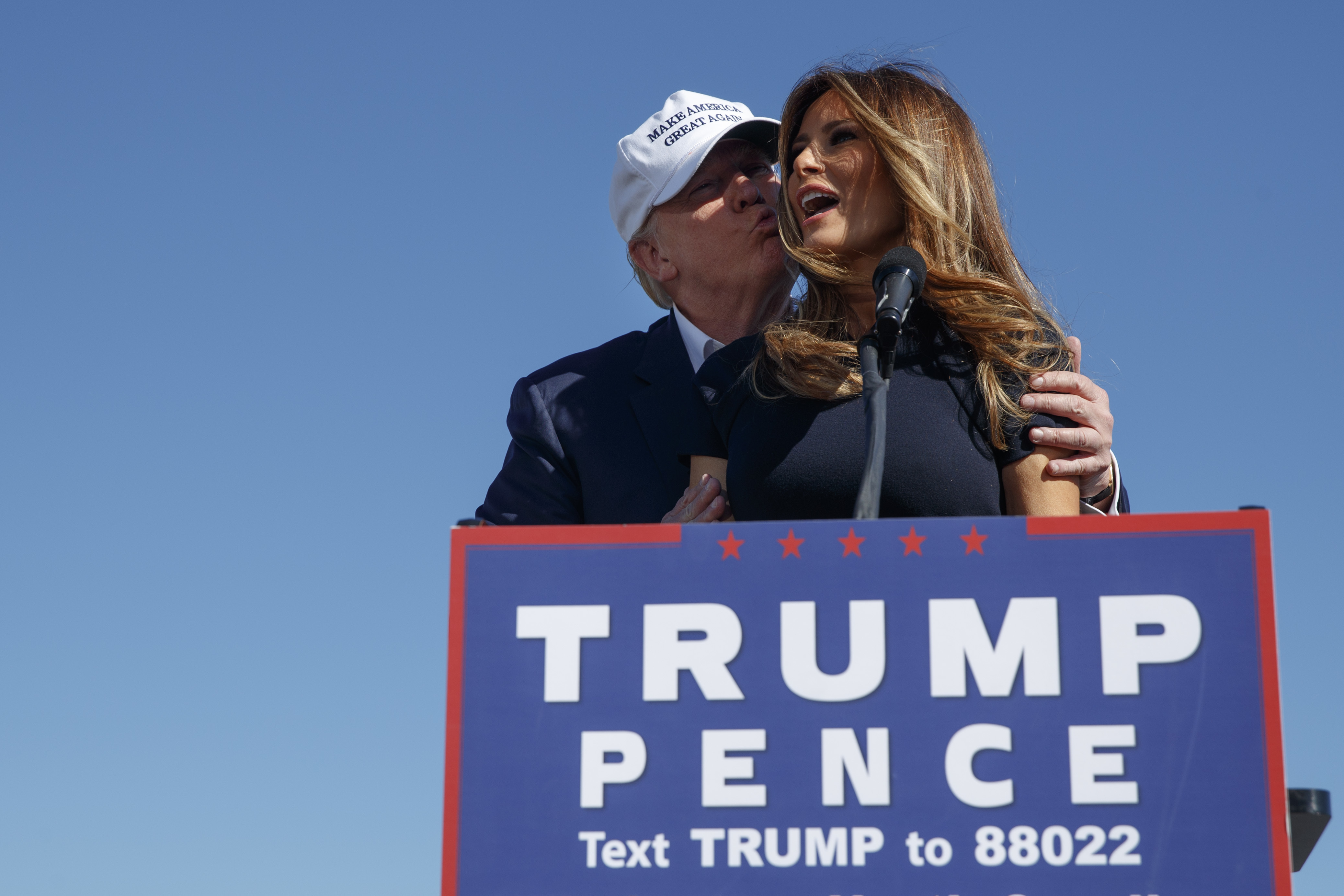 FILE - Republican presidential candidate Donald Trump, left, kisses his wife, Melania, during a campaign rally, Nov. 5, 2016, in Wilmington, N.C. (AP Photo/ Evan Vucci, File)