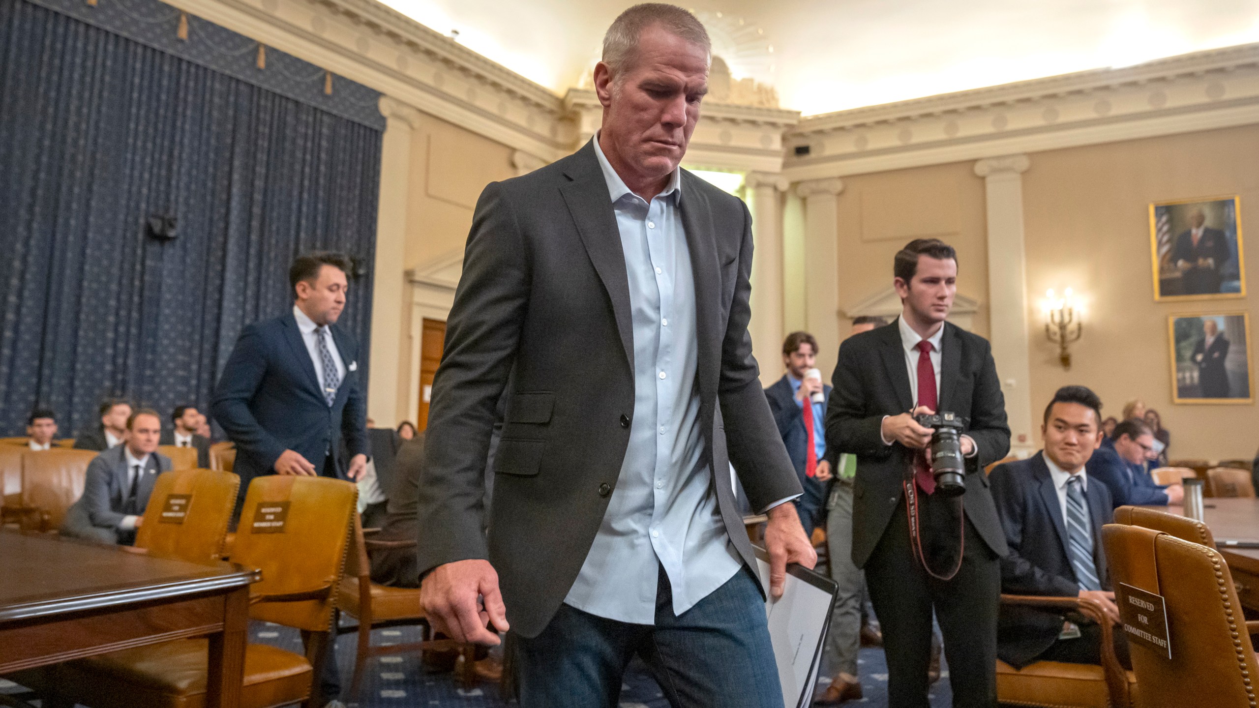 Former NFL quarterback Brett Favre arrives to appear before the House Committee on Ways and Means on Capitol Hill, Tuesday, Sept. 24, 2024, in Washington. (AP Photo/Mark Schiefelbein)