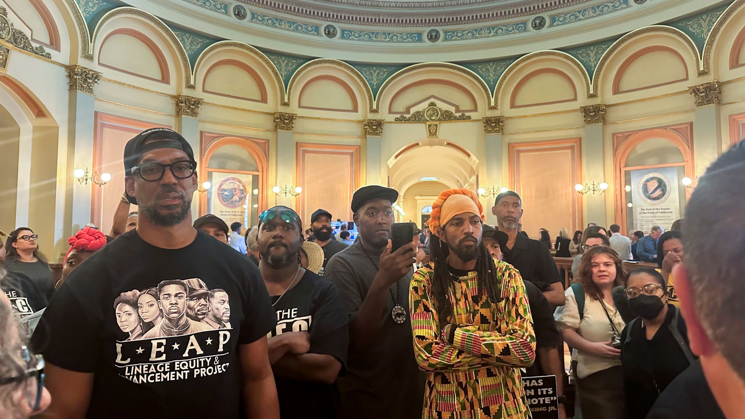 FILE - Members of Coalition for a Just and Equitable California protest and demand lawmakers to take up a vote on two reparations bill in the rotunda on the last day of the legislative year, Aug. 31, 2024, in Sacramento, Calif. (AP Photo/Tran Nguyen, File)