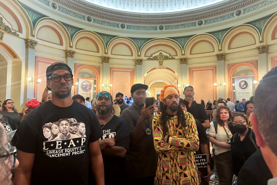 FILE - Members of Coalition for a Just and Equitable California protest and demand lawmakers to take up a vote on two reparations bill in the rotunda on the last day of the legislative year, Aug. 31, 2024, in Sacramento, Calif. (AP Photo/Tran Nguyen, File)