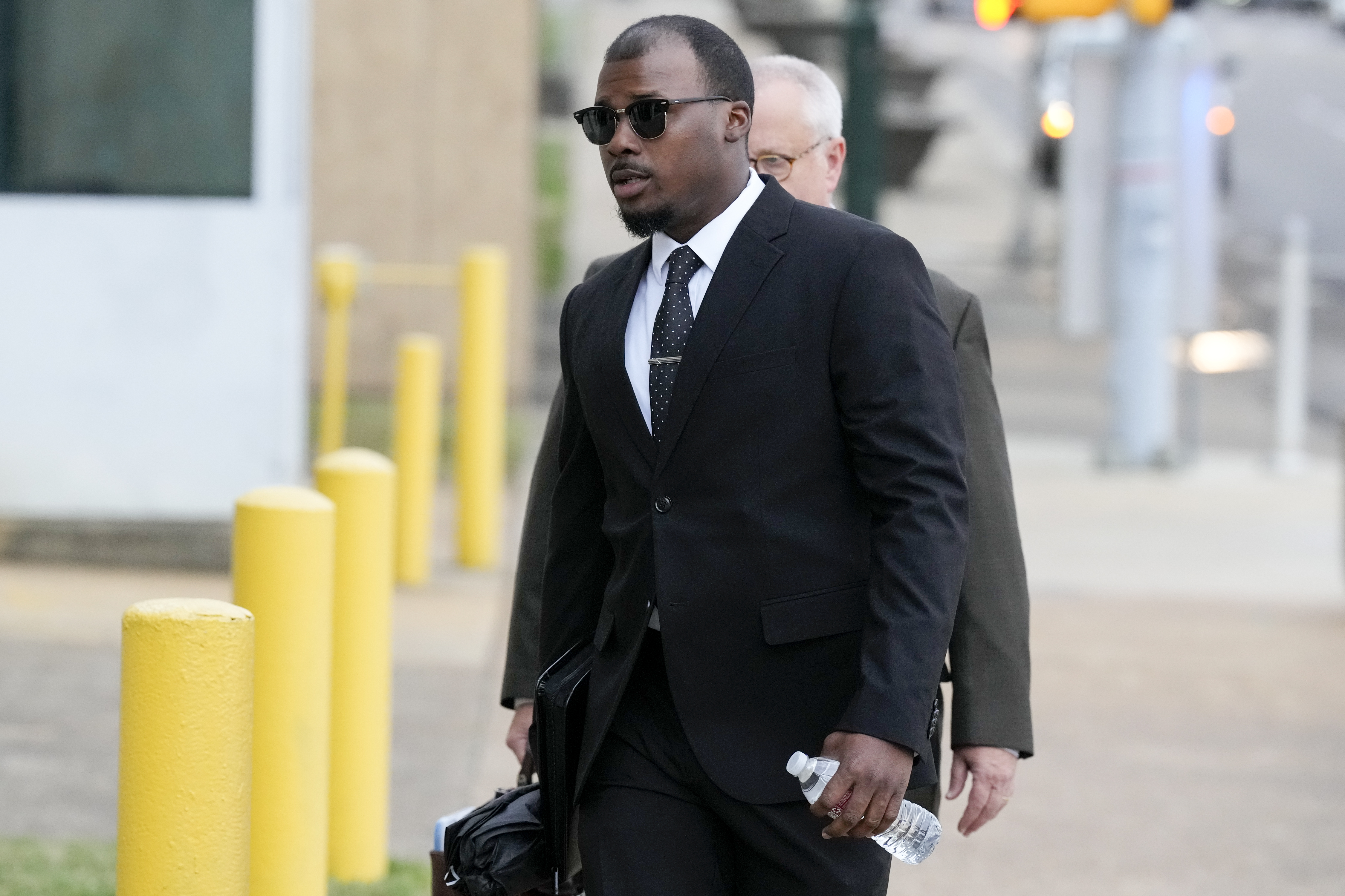 Former Memphis police officer Justin Smith arrives at the federal courthouse for the day's proceedings during the trial in the Tyre Nichols case Wednesday, Sept. 25, 2024, in Memphis, Tenn. (AP Photo/George Walker IV)