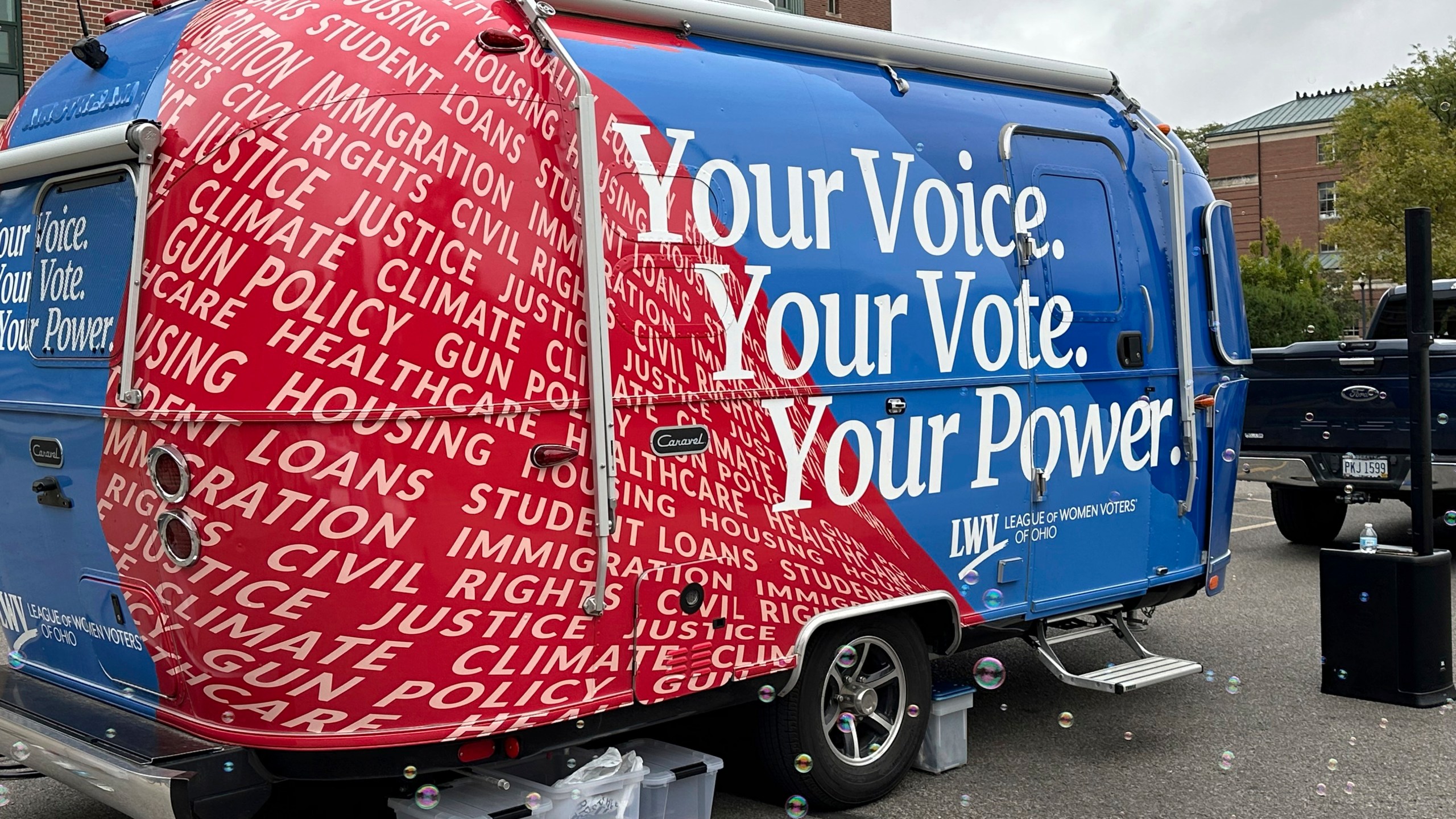 A 19-foot Airstream Caravel on loan to the League of Women Voters of Ohio visits the main campus of the Ohio State University in Columbus, Ohio, Thursday, Sept. 26, 2024, as the group works to register and engage student voters. (AP Photo/Julie Carr Smyth)