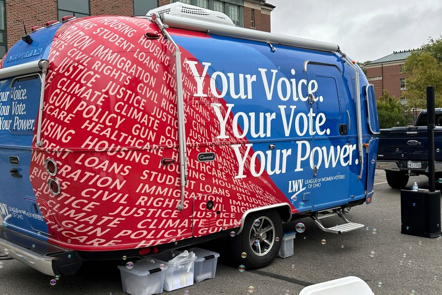 A 19-foot Airstream Caravel on loan to the League of Women Voters of Ohio visits the main campus of the Ohio State University in Columbus, Ohio, Thursday, Sept. 26, 2024, as the group works to register and engage student voters. (AP Photo/Julie Carr Smyth)