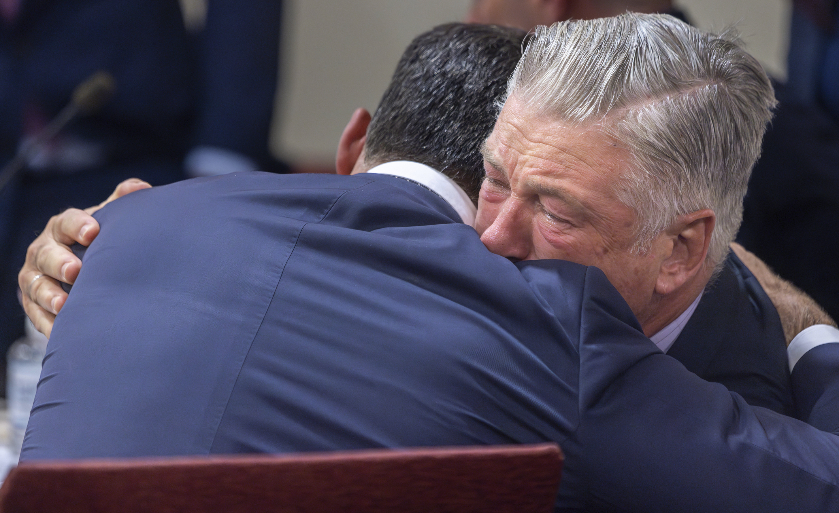 FILE - Actor Alec Baldwin, right, hugs his defense attorney Alex Spiro after District Court Judge Mary Marlowe Sommer threw out the involuntary manslaughter case, July 12, 2024, in Santa Fe, N.M., for the 2021 fatal shooting of cinematographer Halyna Hutchins during filming of the Western movie "Rust." (Luis Sánchez Saturno/Santa Fe New Mexican via AP, Pool, File)