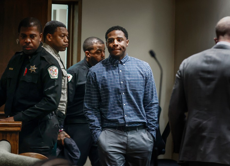 Defendant Justin Johnson, center, enters court before being found guilty of murder in the death of Memphis rapper Young Dolph, in court in Memphis, Tenn., on Thursday, Sept. 26, 2024. (Mark Weber/Daily Memphian via AP, Pool)