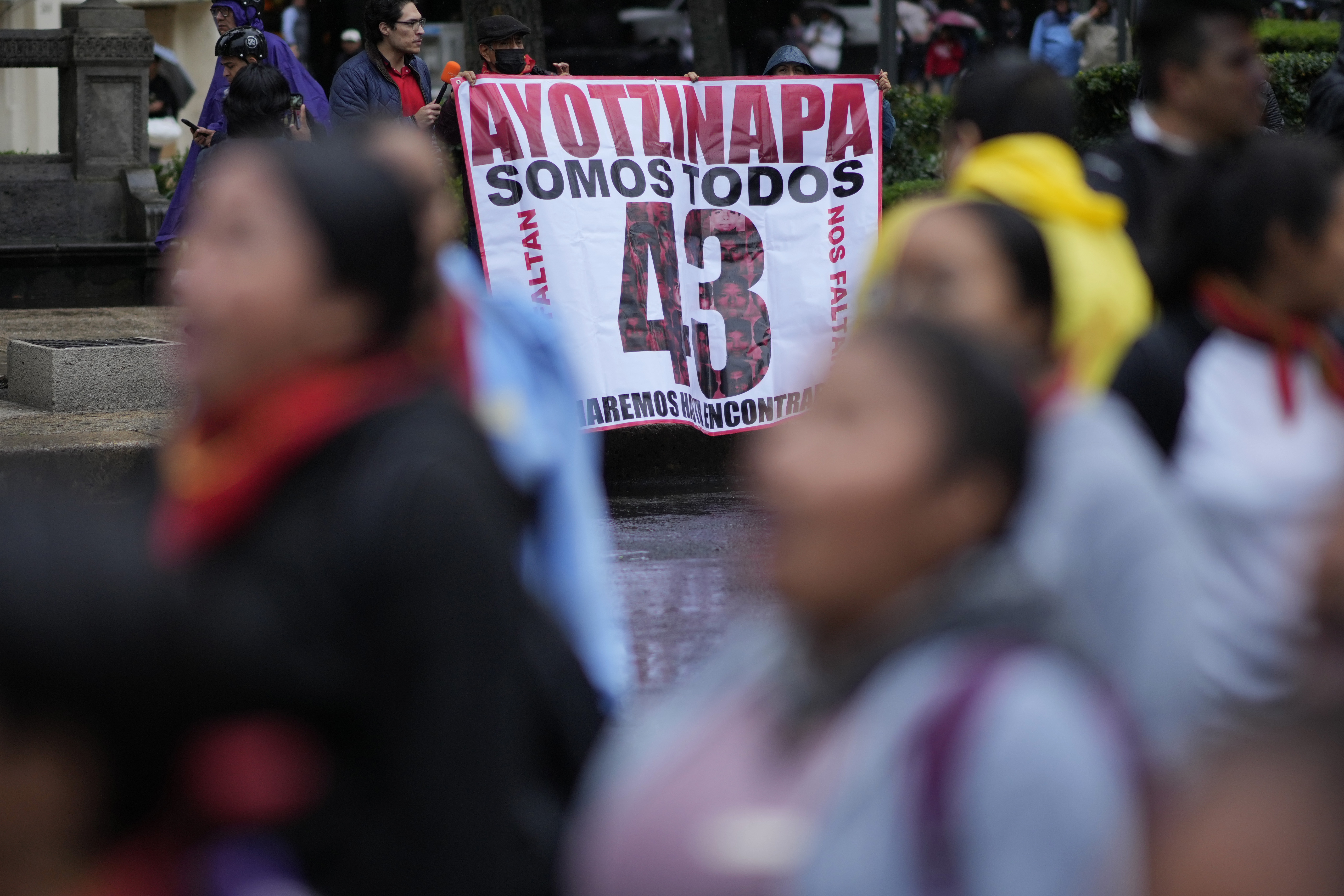 Families and friends take part in a demonstration marking the 10-year anniversary of the disappearance of 43 students from an Ayotzinapa rural teacher's college, in Mexico City, Thursday, Sept. 26, 2024. (AP Photo/Eduardo Verdugo)