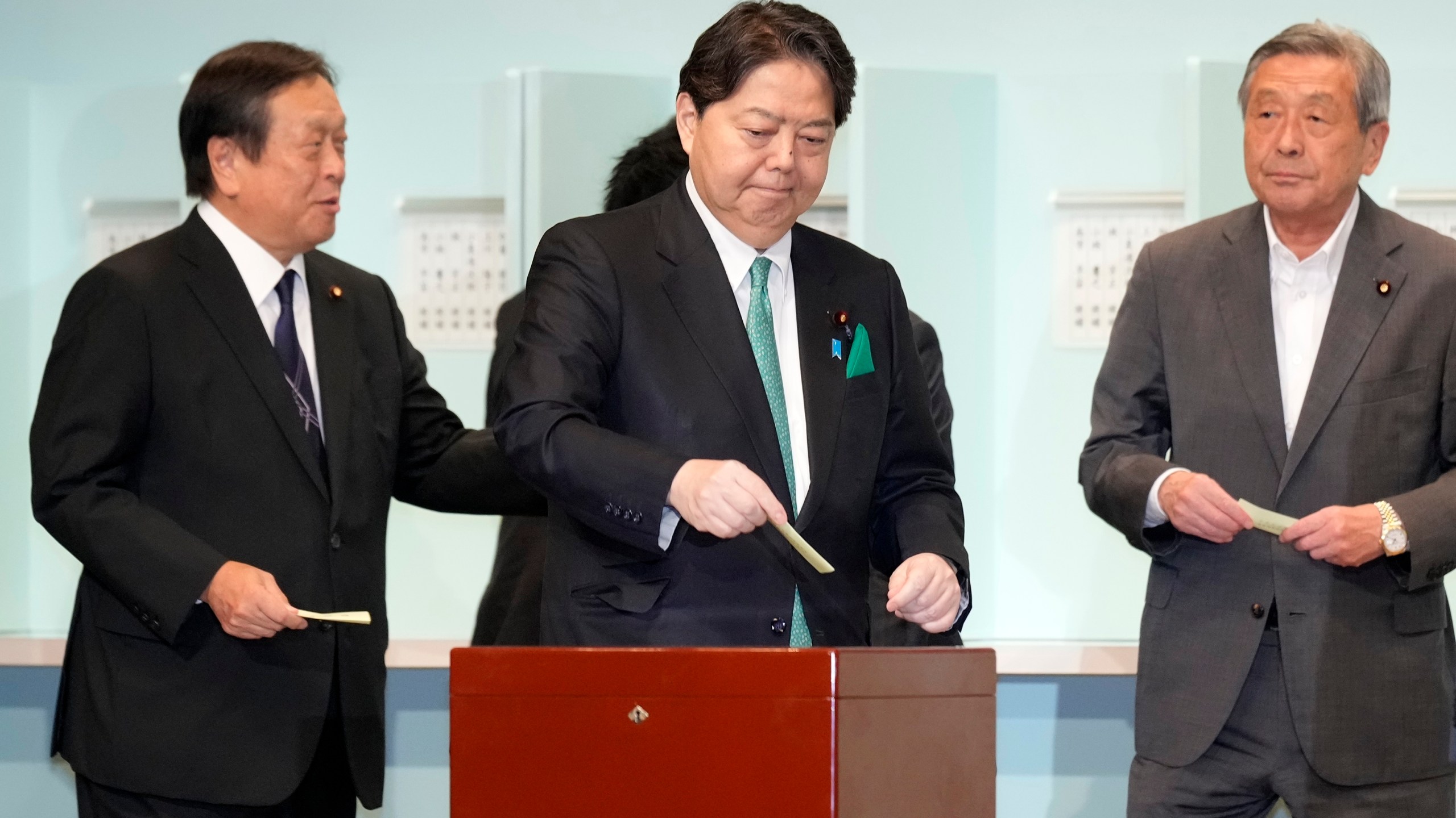 One of candidates, Yoshimasa Hayashi, center, casts his ballot at the Liberal Democratic Party's (LDP) leadership election Friday, Sept. 27, 2024, in Tokyo. (AP Photo/Hiro Komae, Pool)