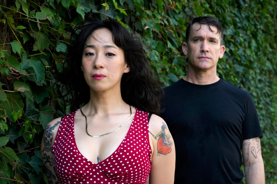 Angela Seo, left, and Jamie Stewart of the band Xiu Xiu pose for a portrait in Berlin, Germany, Wednesday, Aug. 28, 2024. (AP Photo/Markus Schreiber)