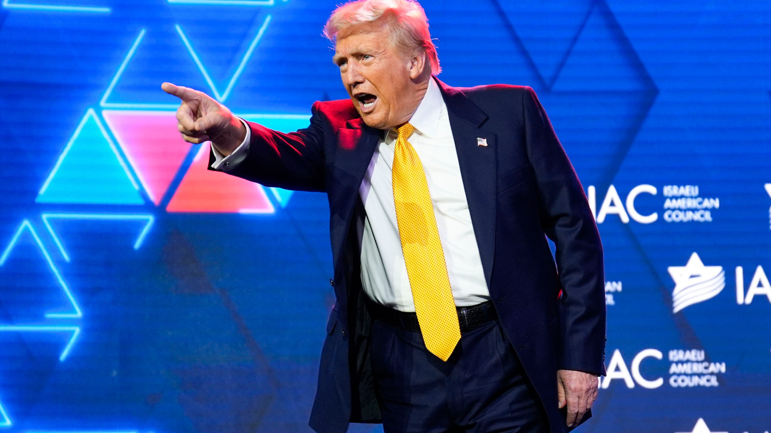 Republican presidential nominee former President Donald Trump acknowledges the crowd after speaking at the Israeli American Council National Summit, Thursday, Sept. 19, 2024, in Washington. (AP Photo/Evan Vucci)