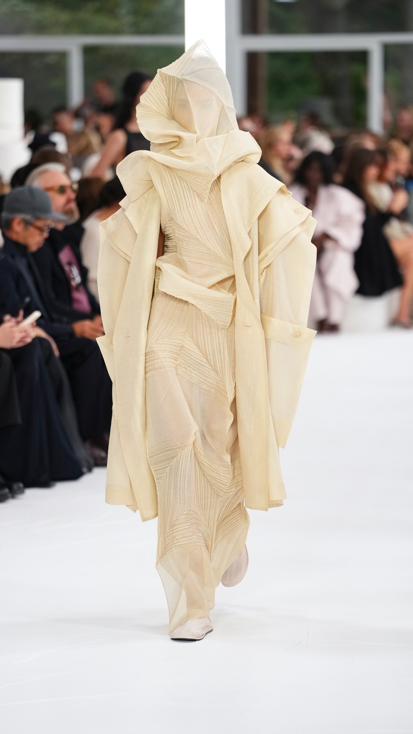 A model wears a creation as part of the Issey Miyake Spring/Summer 2025 collection presented Friday, Sept. 27, 2024 in Paris. (Photo by Scott A Garfitt/Invision/AP)