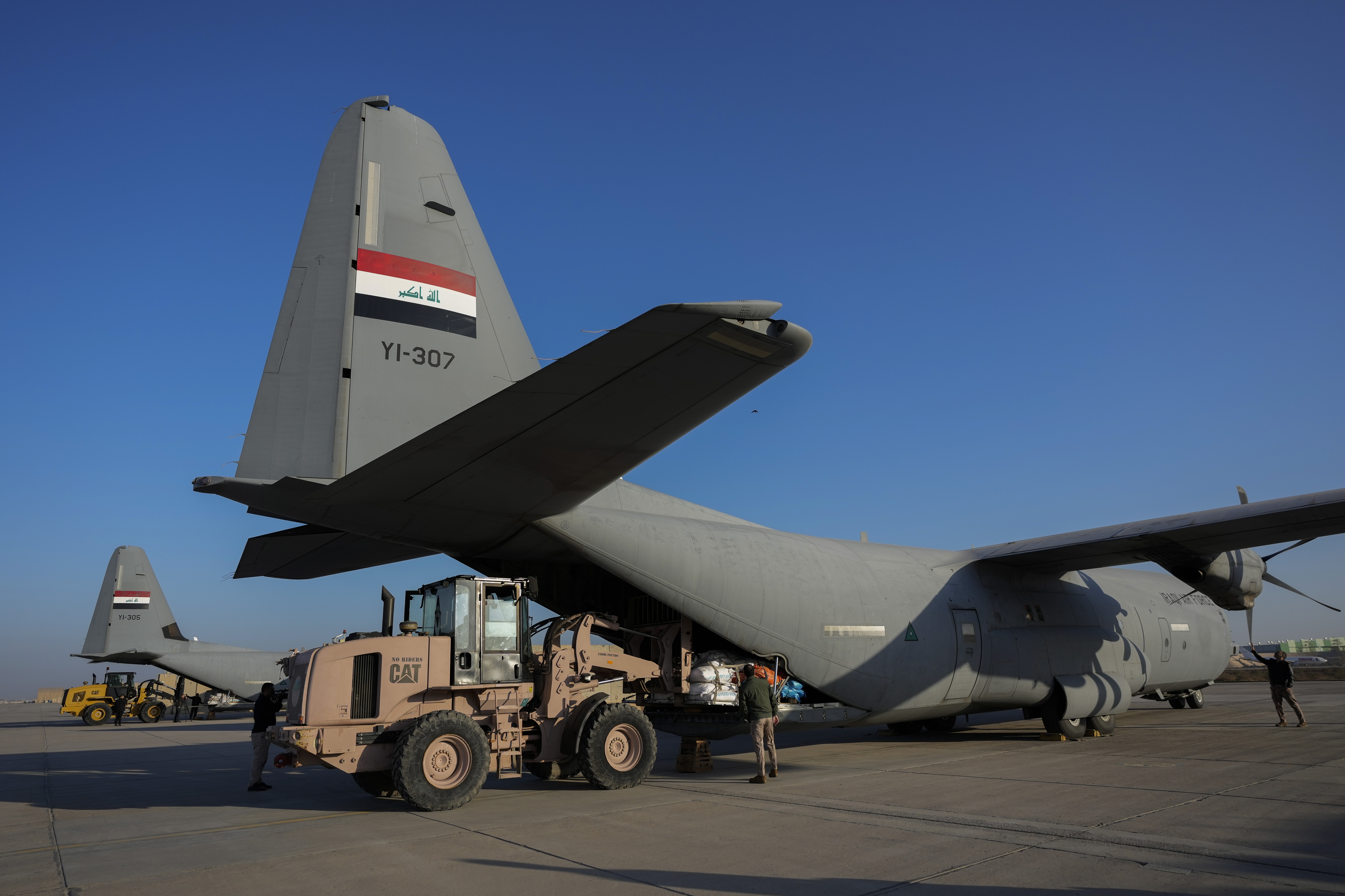 FILE - Iraqi security forces prepare for loading humanitarian aid from Red Crescent for Palestinians in Gaza, before its departure from a military airbase near Baghdad International Airport in Baghdad, Iraq, Jan. 24, 2024. (AP Photo/Hadi Mizban, File)