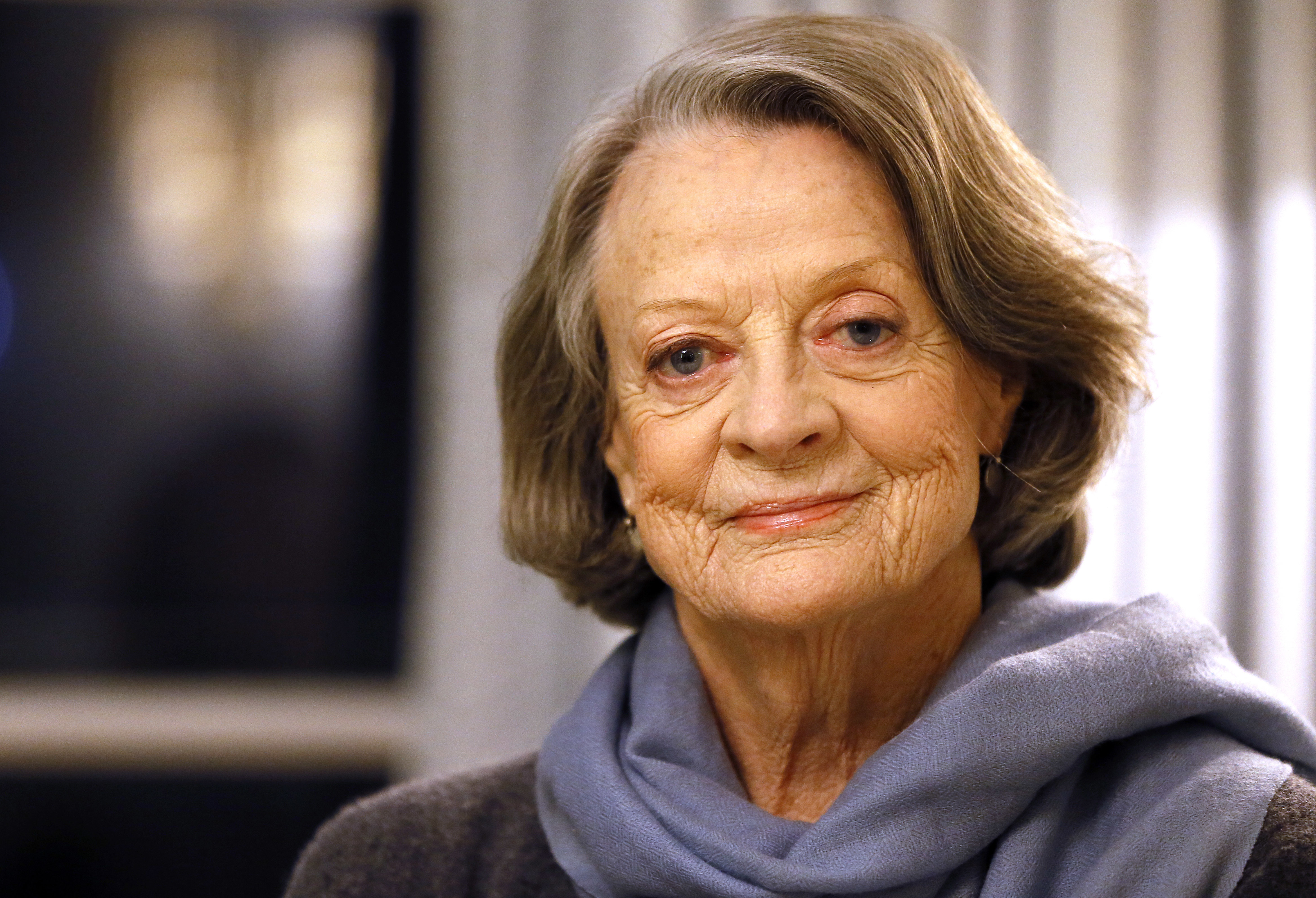 FILE - British actress Dame Maggie Smith poses in London on Dec. 16, 2015. Smith, who won an Oscar for “The Prime of Miss Jean Brodie” in 1969 and won new fans in the 21st century as the dowager Countess of Grantham in “Downton Abbey,” has died at 89. (AP Photo/Kirsty Wigglesworth, File)