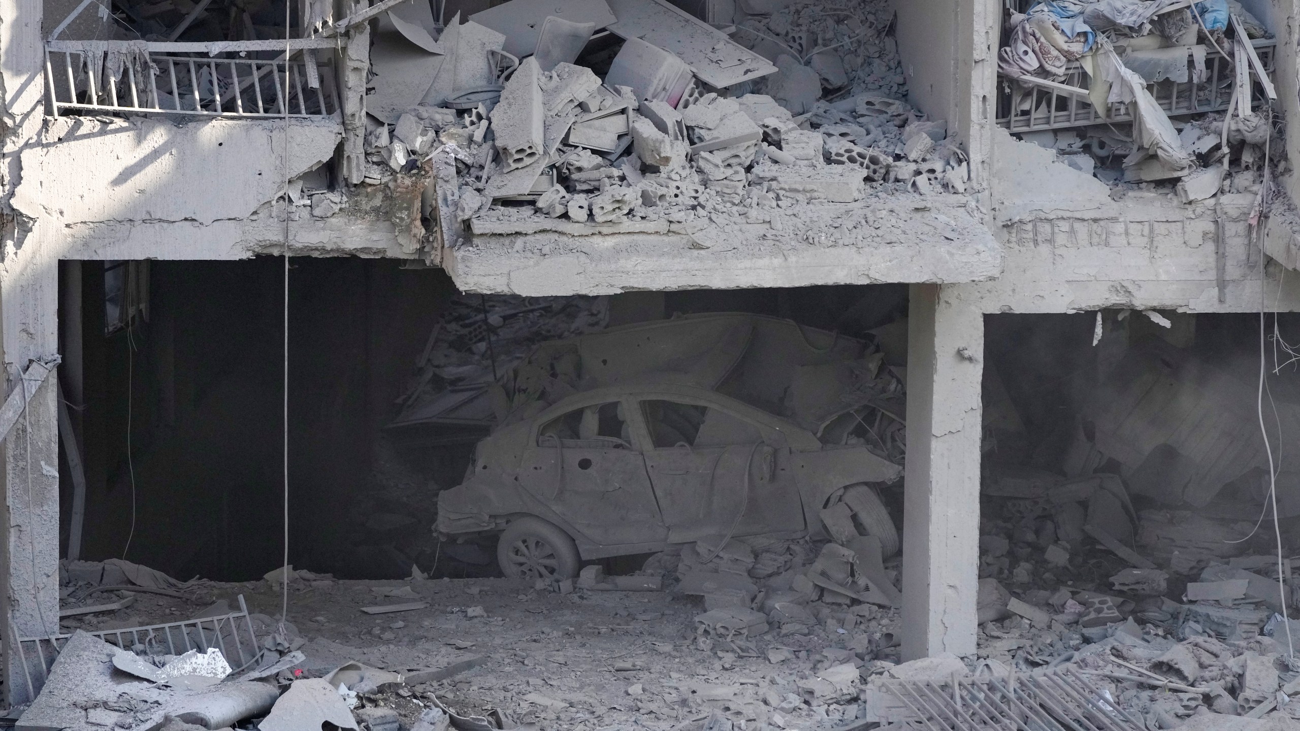 A destroyed building at the site of an Israeli airstrike in Beirut's southern suburbs, Sunday, Sept. 29, 2024. (AP Photo/Hassan Ammar)