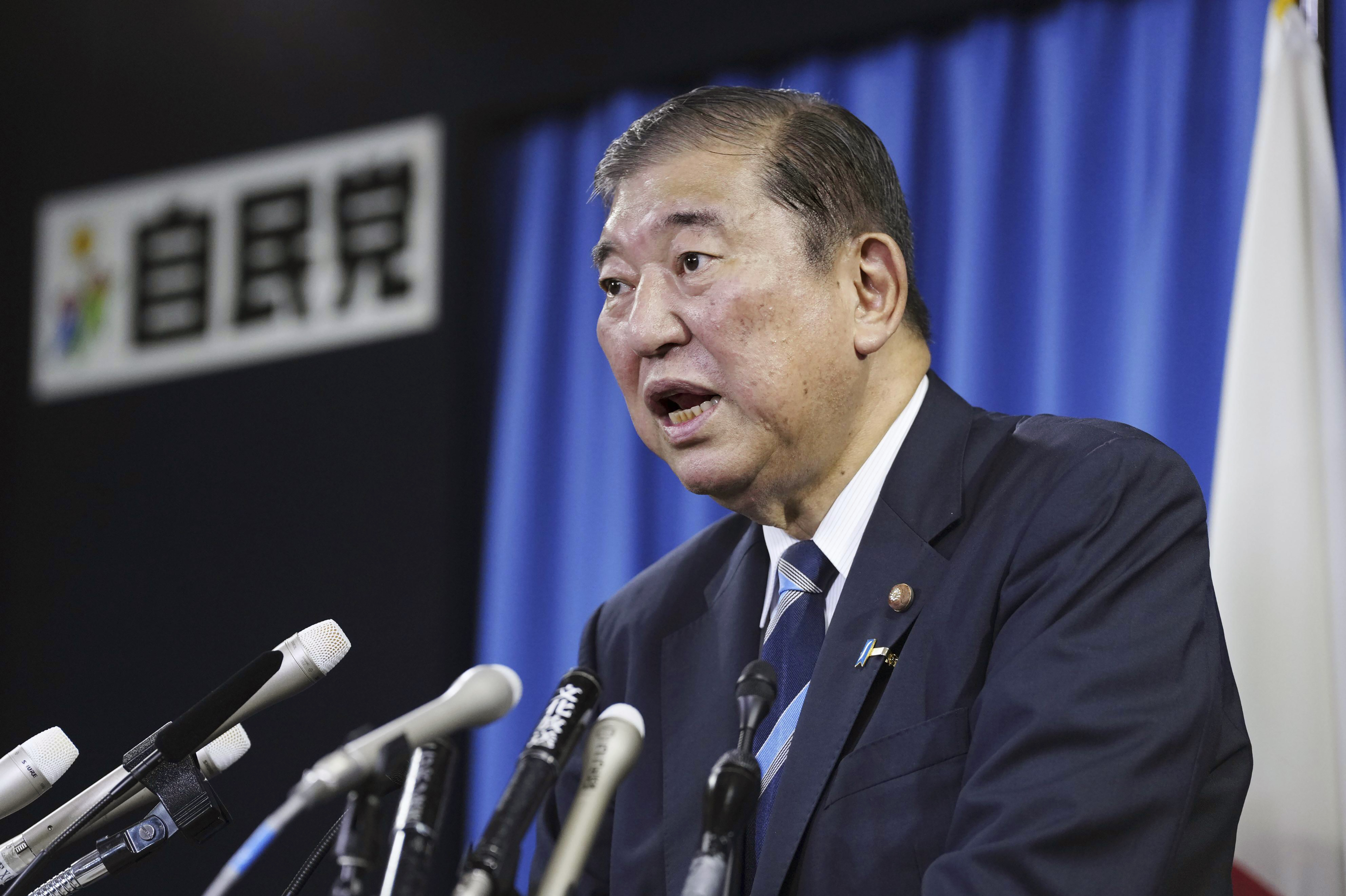 Shigeru Ishiba, the head of Japan's governing party, the Liberal Democratic Party speaks during a press conference at the party's headquarters in Tokyo Monday, Sept. 30, 2024 to announce that he plans to call a parliamentary election on Oct. 27 after he is formally elected as prime minister. (Kyodo News via AP)