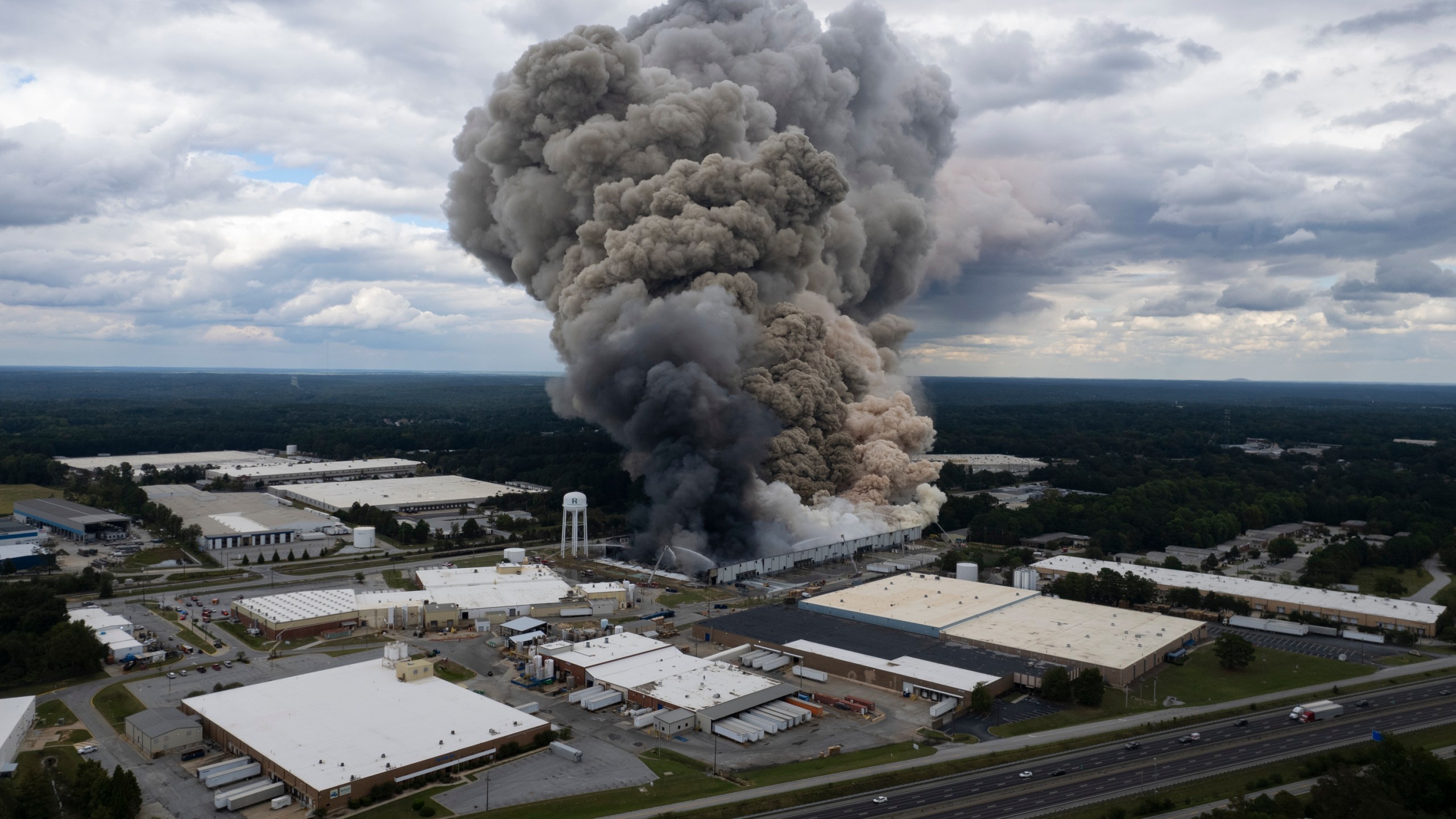 Smoke billows from a fire at the BioLab facility in Conyers, Ga., Sunday, Sept. 29, 2024. (Ben Gray/Atlanta Journal-Constitution via AP)