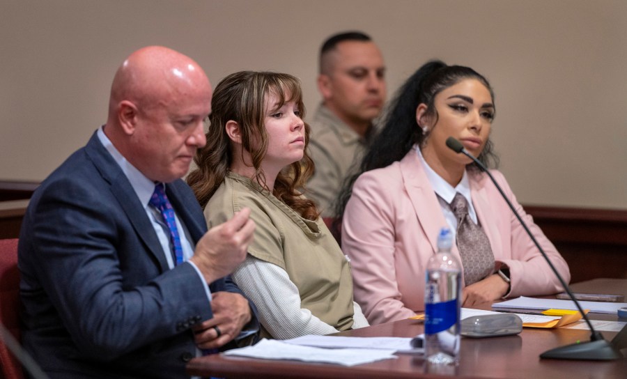 FILE - Hannah Gutierrez-Reed, center, with her attorney Jason Bowles, left, and paralegal Carmella Sisneros, right, prepare for a sentencing hearing in state district court in Santa Fe, N.M., April 15, 2024. (Eddie Moore/The Albuquerque Journal via AP, Pool, File)