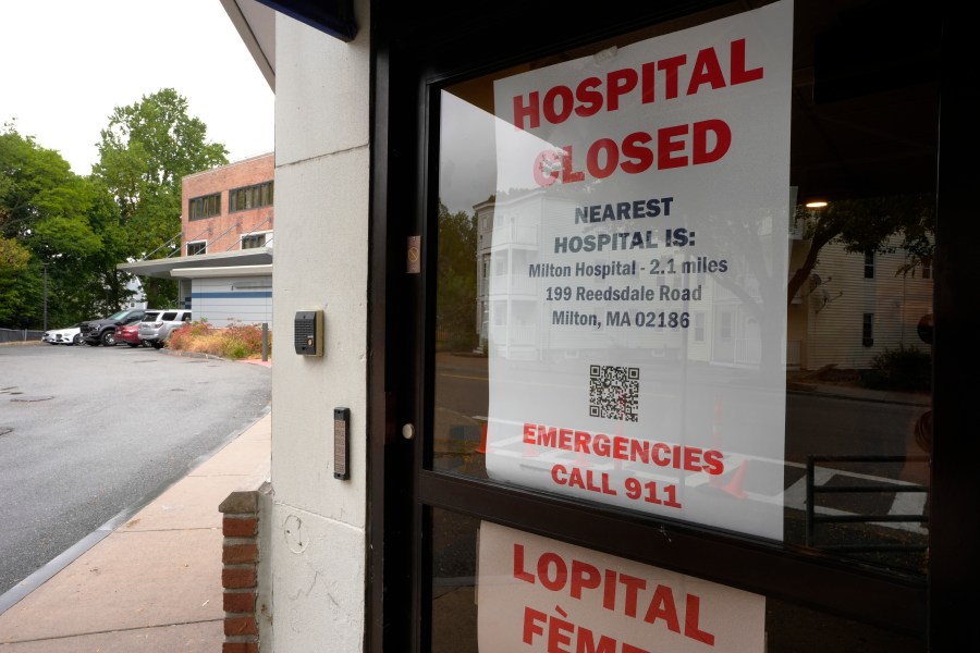 A closed sign is posted on a glass door at a entrance to a building on grounds of the closed Carney Hospital, Thursday, Sept. 19, 2024, in the Dorchester neighborhood of Boston. (AP Photo/Steven Senne)