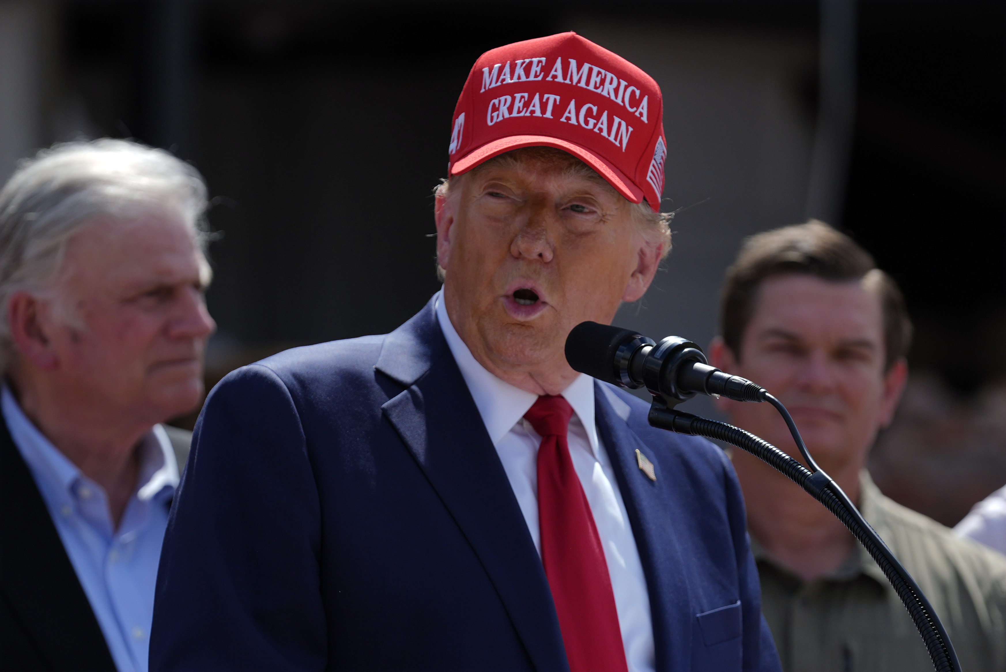 Republican presidential nominee former President Donald Trump speaks outside the Chez What furniture store as he visits Valdosta, Ga., a town impacted by Hurricane Helene, Monday, Sept. 30, 2024. (AP Photo/Evan Vucci)